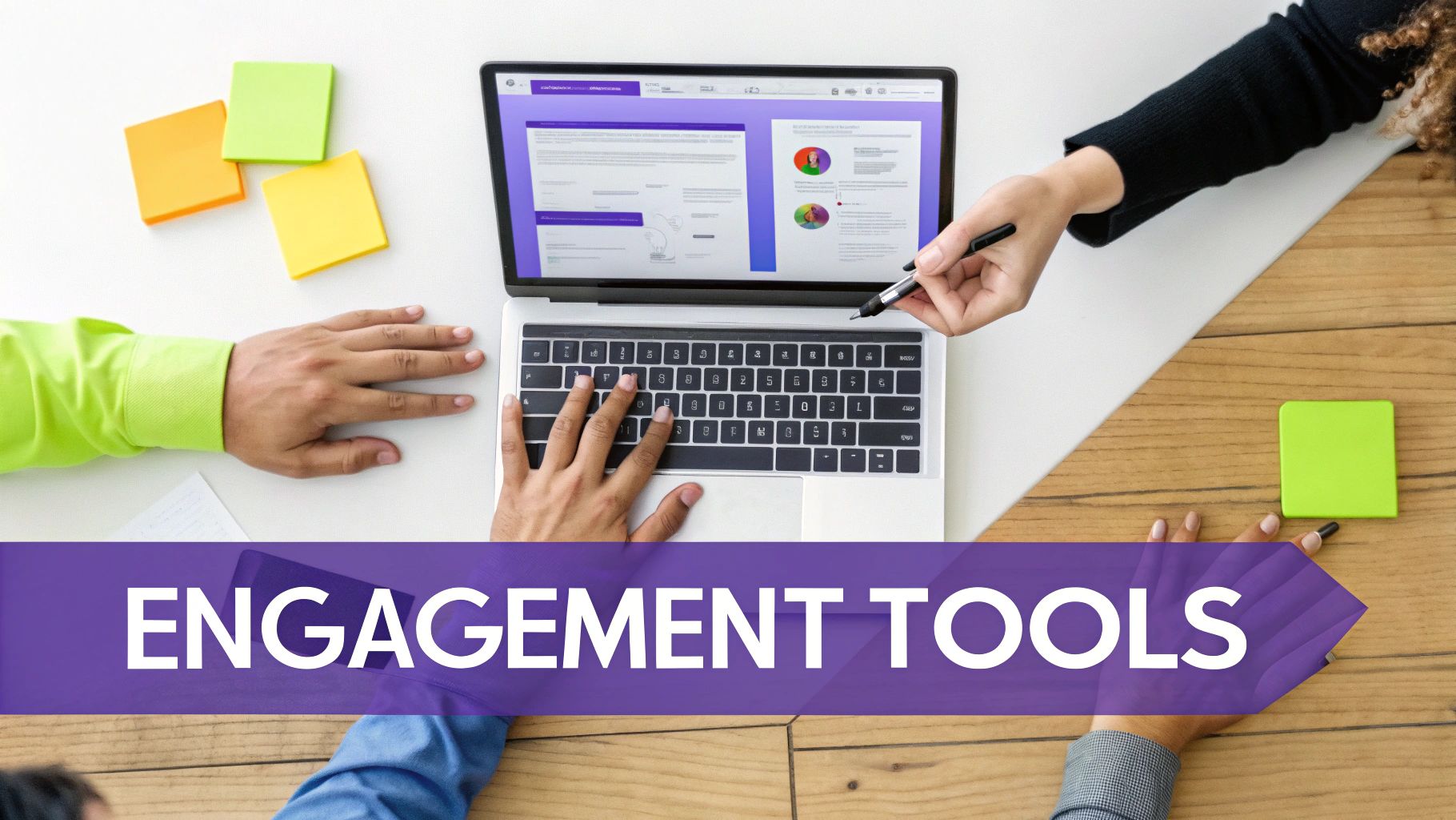 Top-down view of people collaborating on a laptop, using engagement tools and colorful sticky notes.