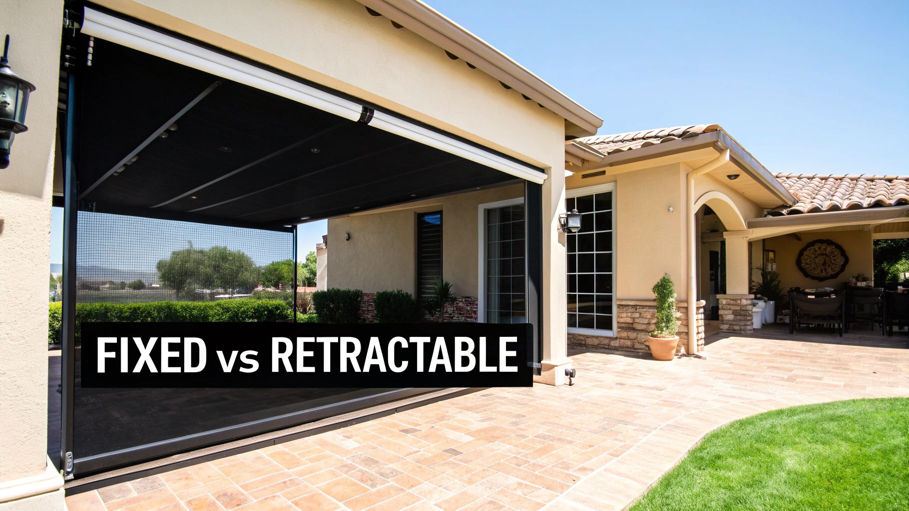 A luxurious patio with a retractable screen system, showing one screen partially lowered against a backdrop of a beautiful garden.