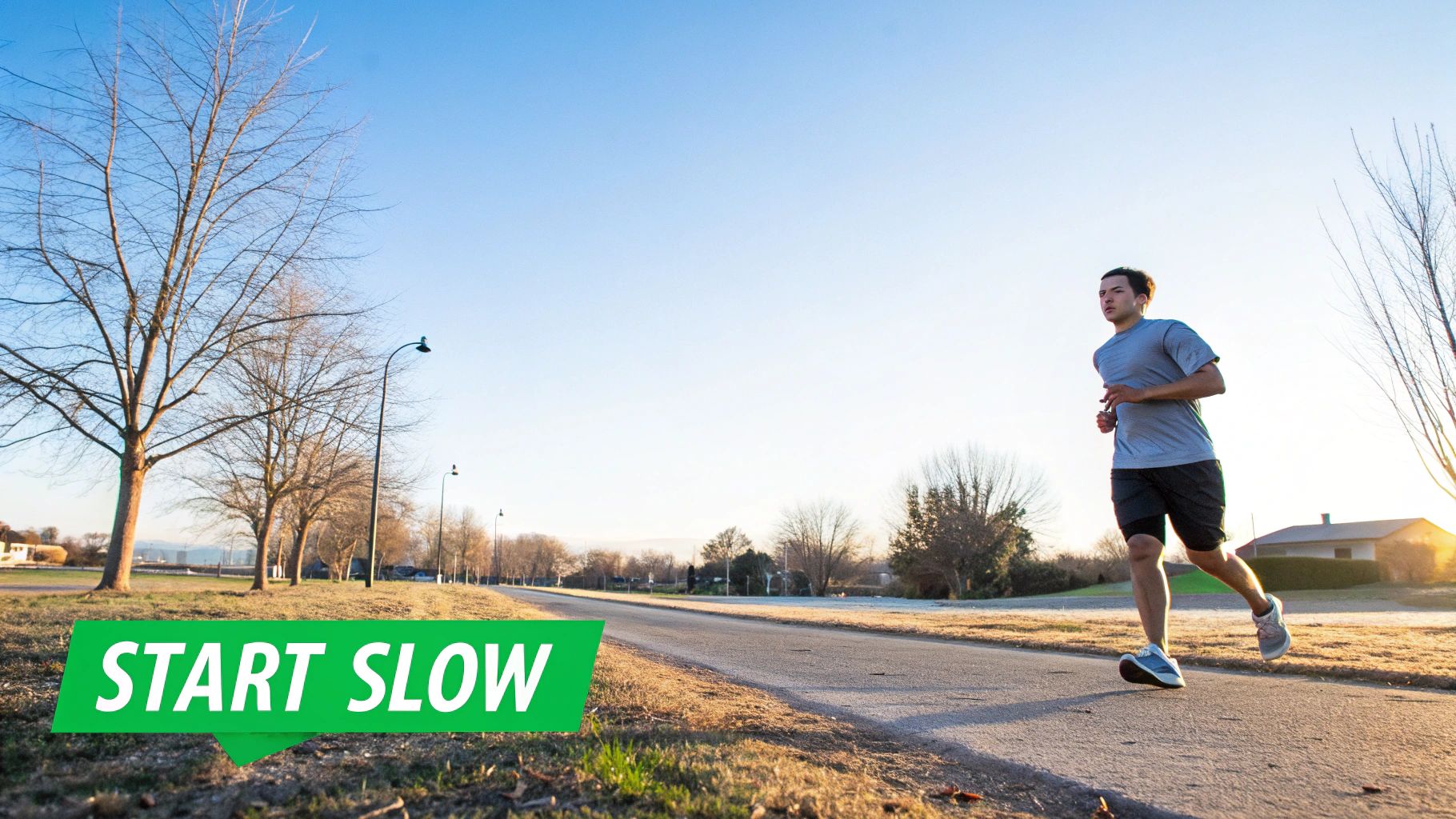 Runner looking focused while training on a track.