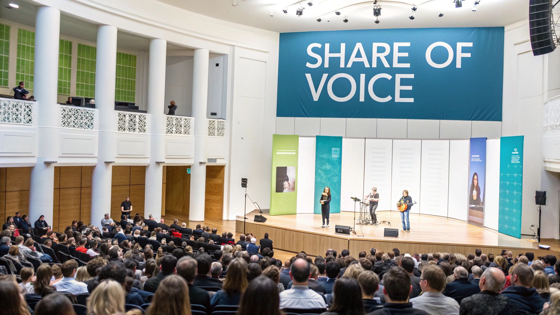 A concert hall with a crowd facing a stage, symbolizing a brand's share of voice in a crowded market.