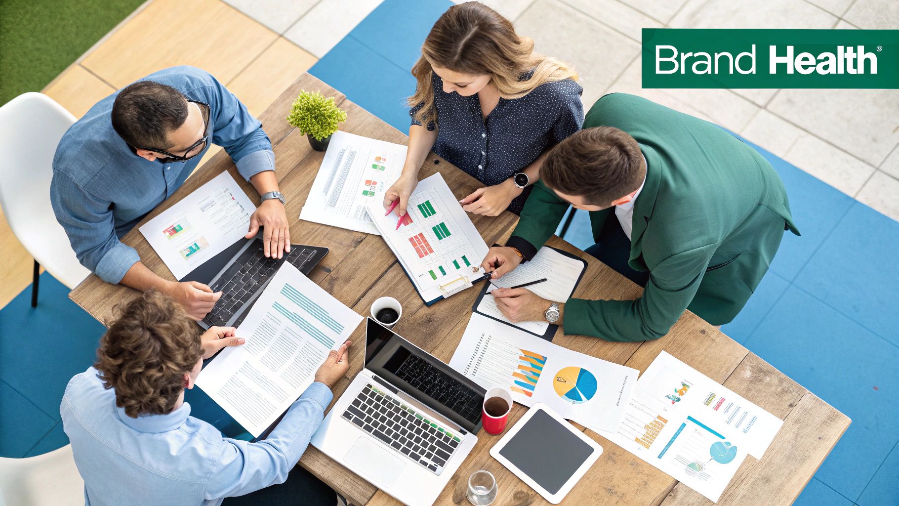 A person looking at a screen with various charts and graphs representing brand health metrics.