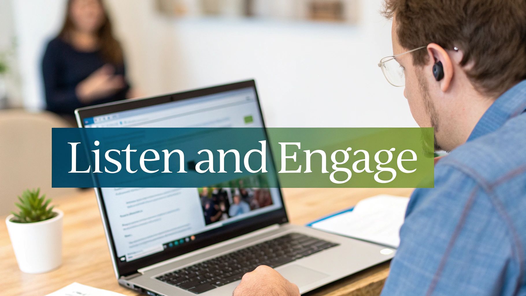 A man with an earbud and glasses looks at a laptop displaying "Listen and Engage".