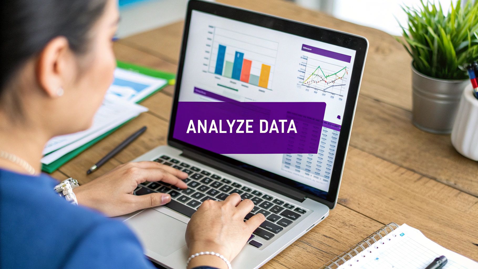 Two happy colleagues collaborating on a laptop, representing a positive work environment.