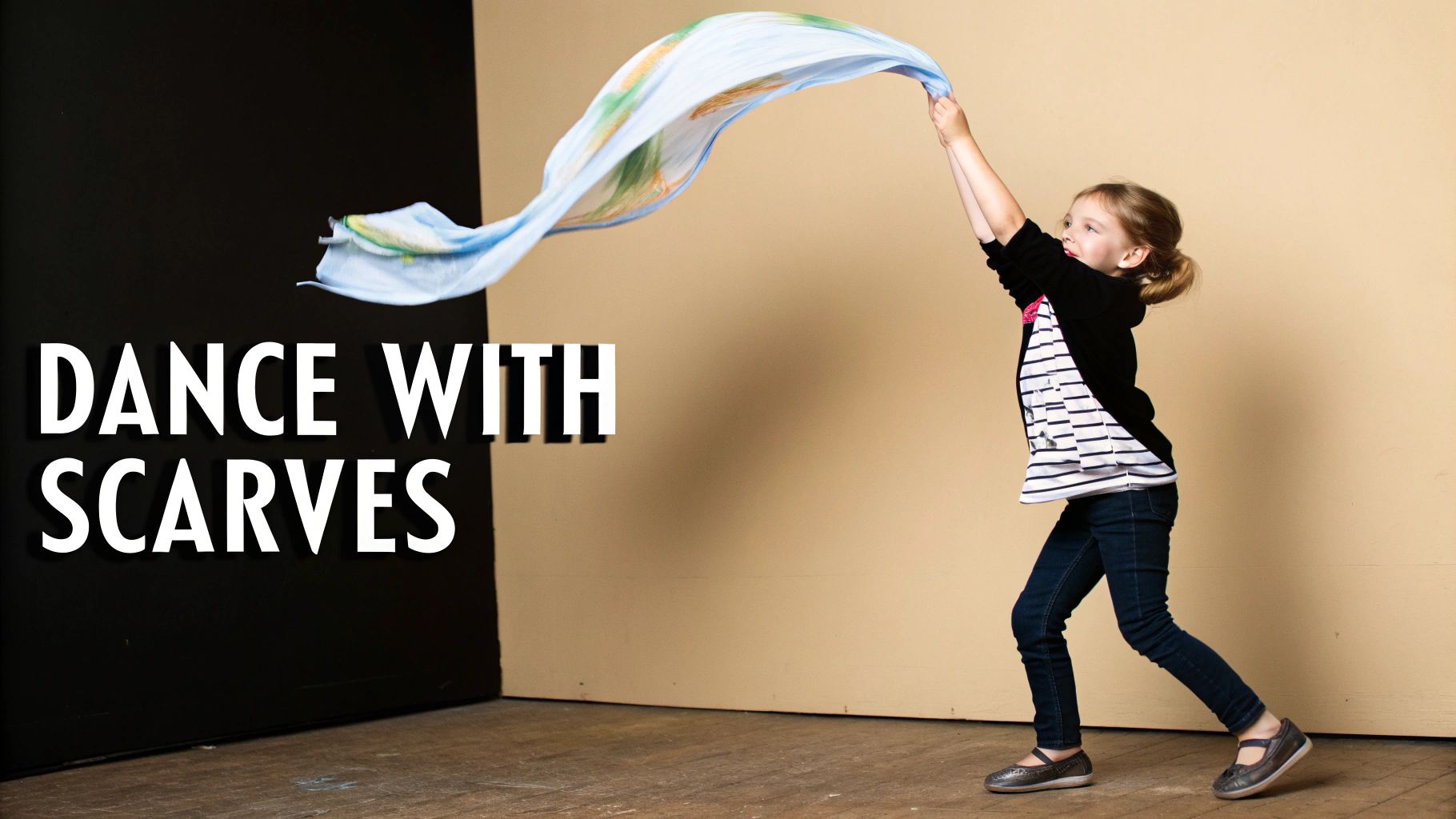 A young girl joyfully dances with a flowing light blue scarf, arms raised, against a black and beige background.