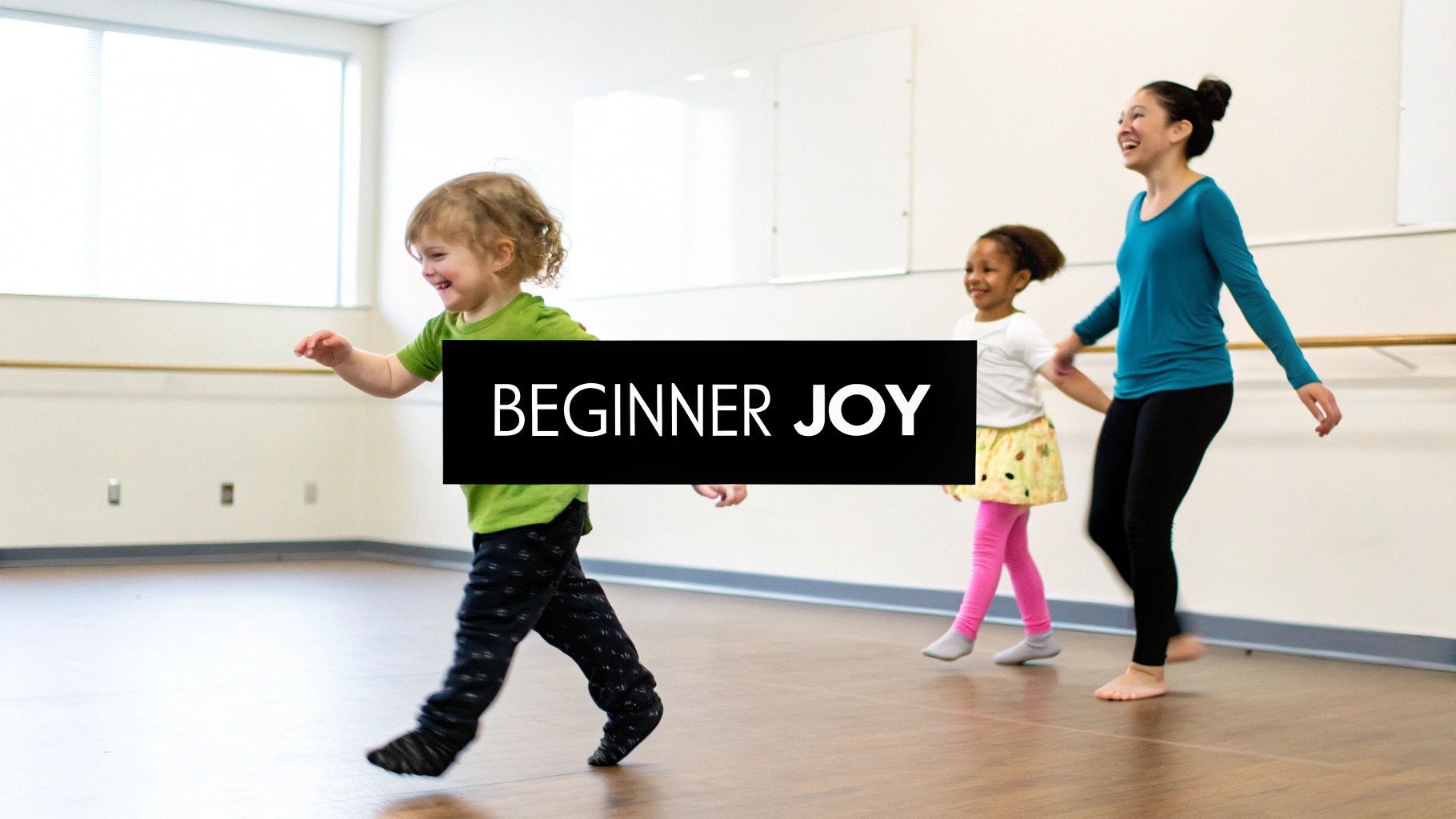 A joyful instructor and two young children laugh while dancing in a bright studio.