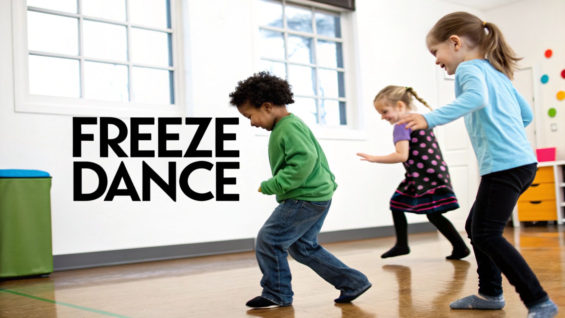 Three joyful children, two girls and one boy, dance on a wooden floor, playing freeze dance.
