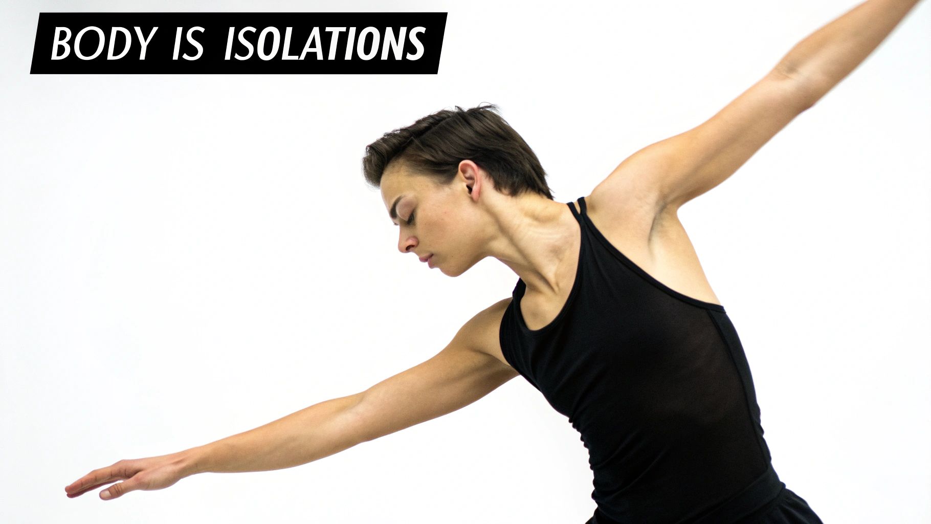 A female dancer with short hair in a black tank top performs a body isolation movement.