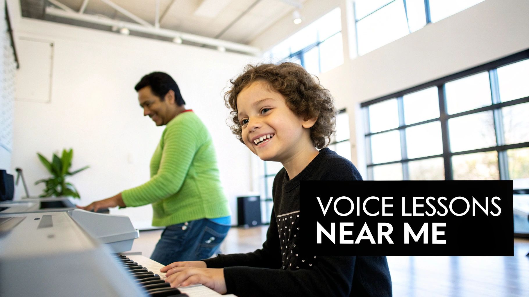 A happy young boy playing a keyboard in a music lesson, with an instructor in the background.