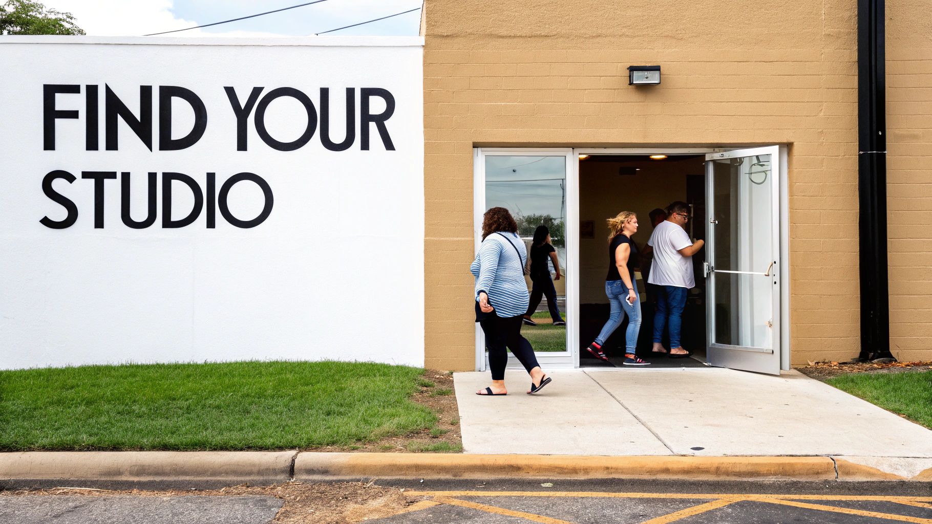 People walking into a building with a large sign that says 'FIND YOUR STUDIO'.