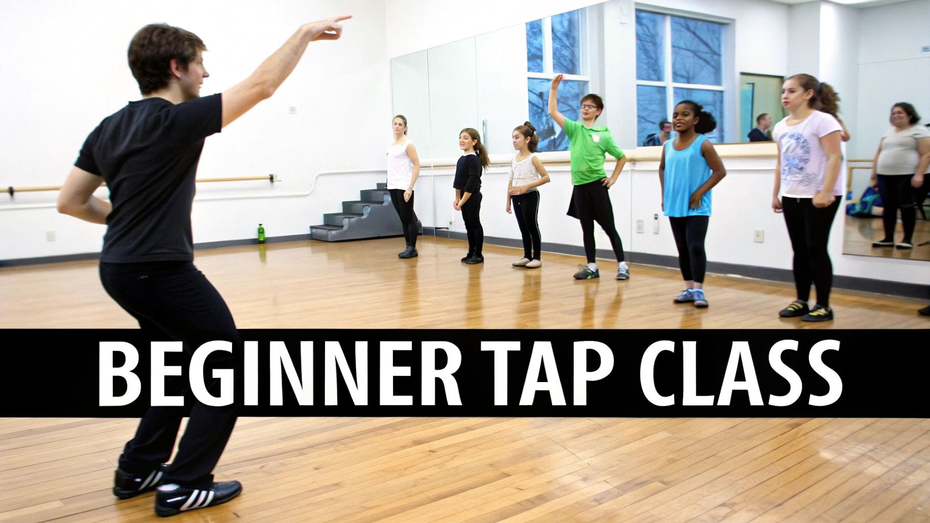 Instructor leading beginner tap dance class with diverse students in bright dance studio