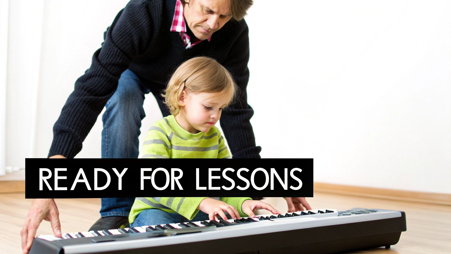 An adult guides a focused young child learning to play piano on a keyboard, ready for lessons.