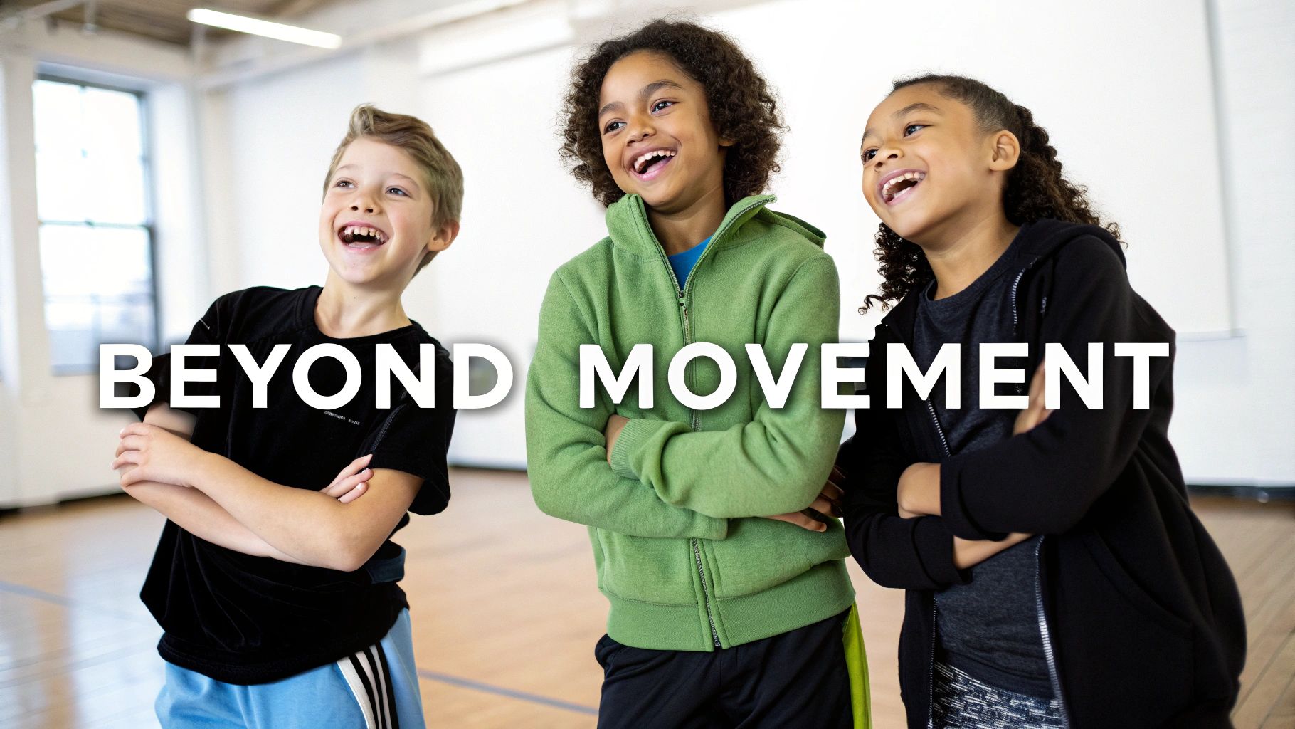 Three diverse children joyfully laughing with crossed arms in a bright dance studio.