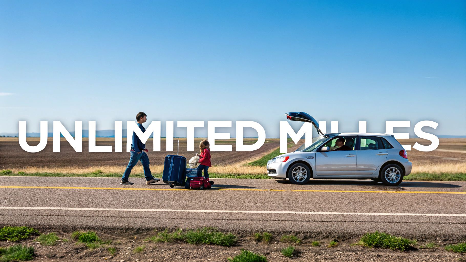 A person driving a rental car on an open road with mountains in the background, representing the freedom of unlimited mileage.