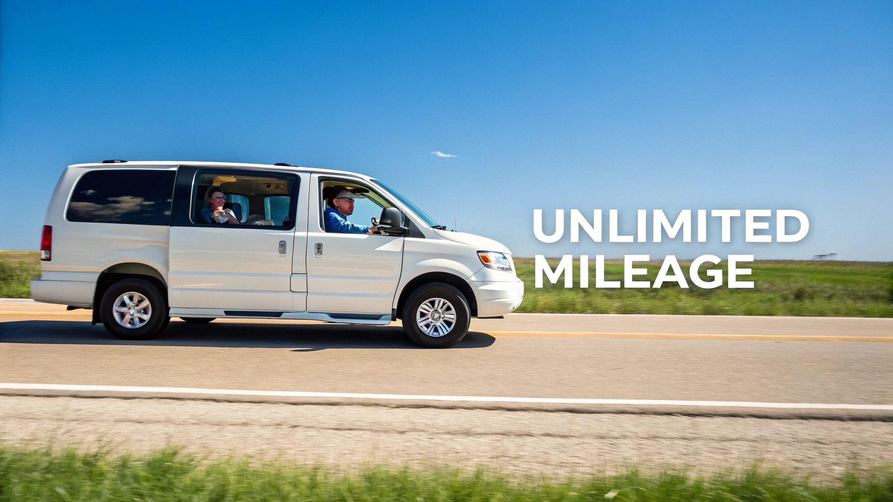 A white 12-passenger van with people inside drives on a highway under a blue sky, featuring 'UNLIMITED MILEAGE'.