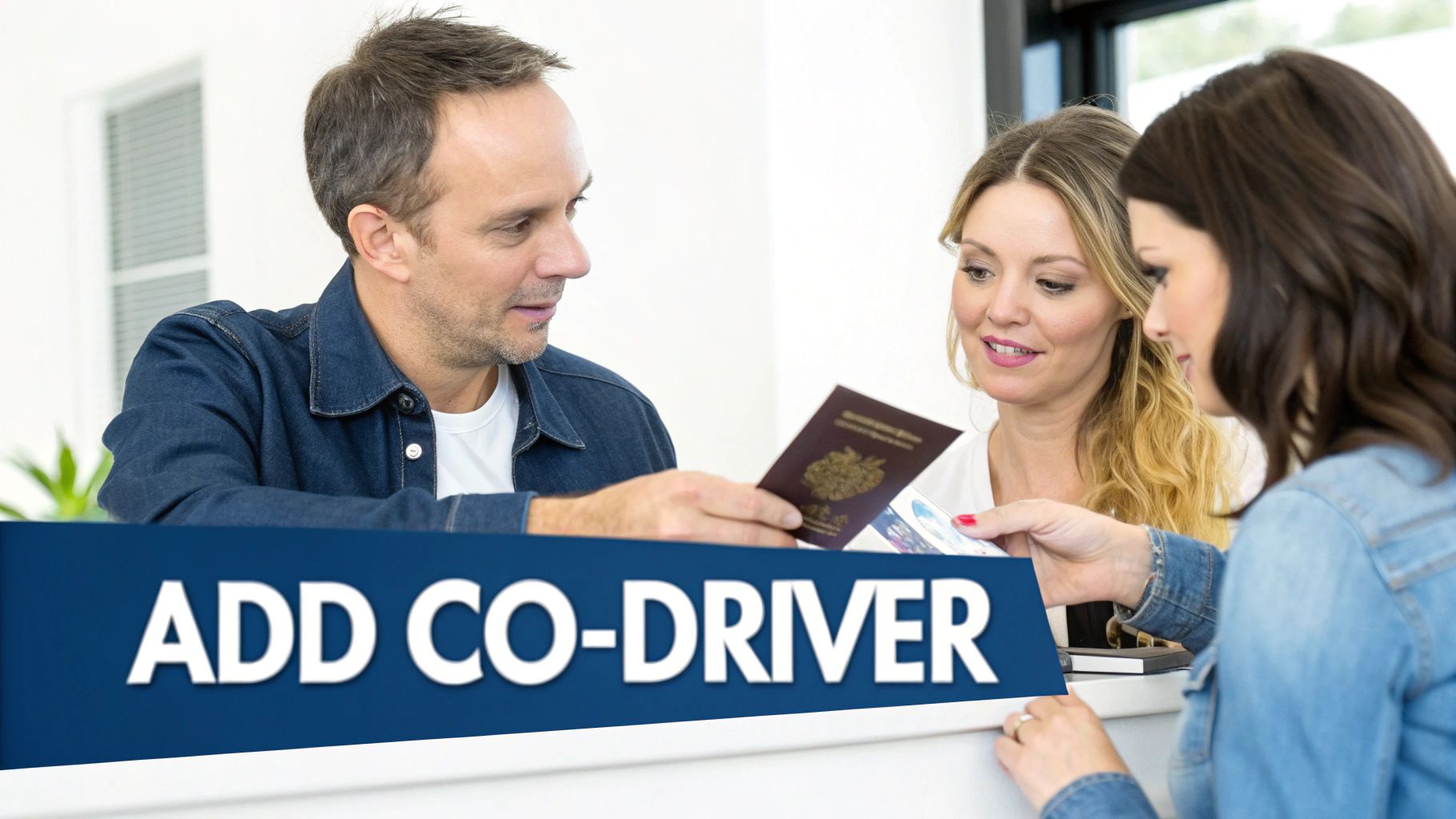 A person signing a car rental agreement at a counter.