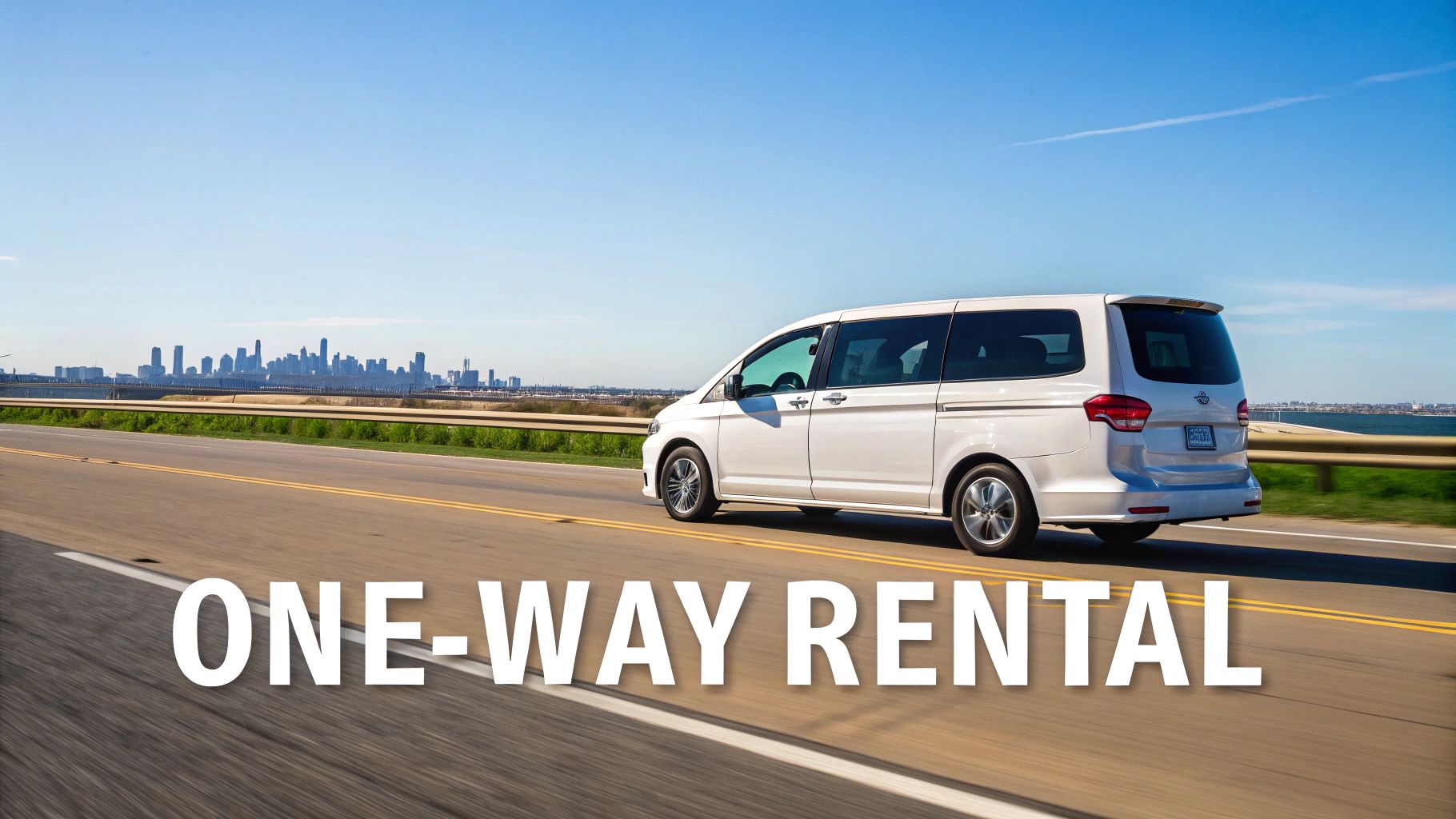 A white minivan drives on a highway, with text 'ONE-WAY RENTAL' on the road and a city skyline in the background.