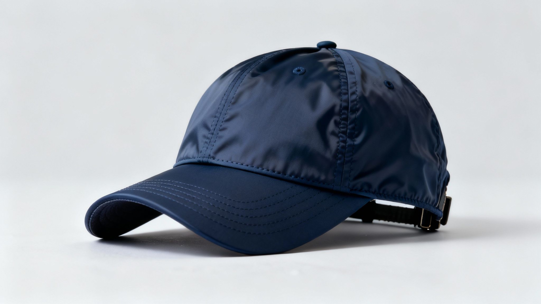 A person wearing a black golf hat on the course.