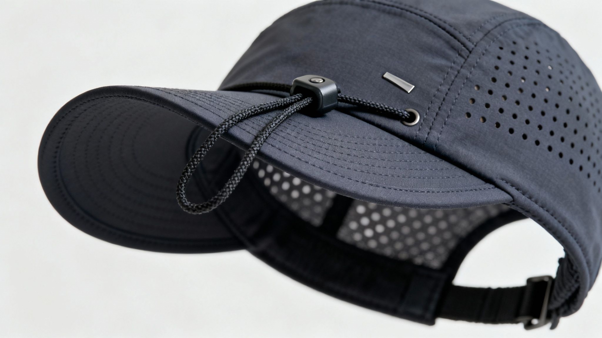 A close-up of a modern golf hat showing its adjustable strap and breathable fabric.