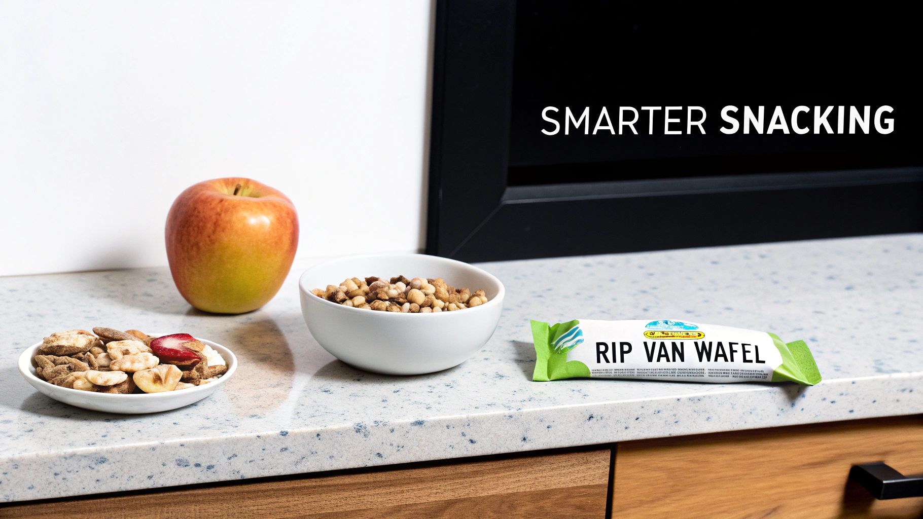 A counter displays various healthy snack options: an apple, trail mix, granola, and a Rip Van Wafel bar.