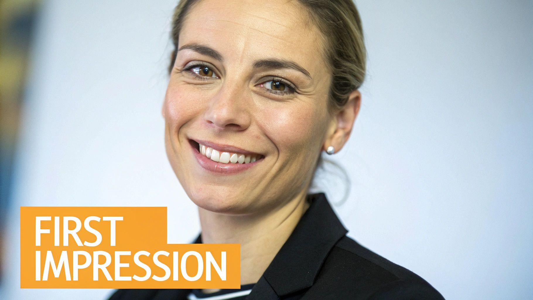 A professionally dressed person smiling in a headshot for their LinkedIn profile