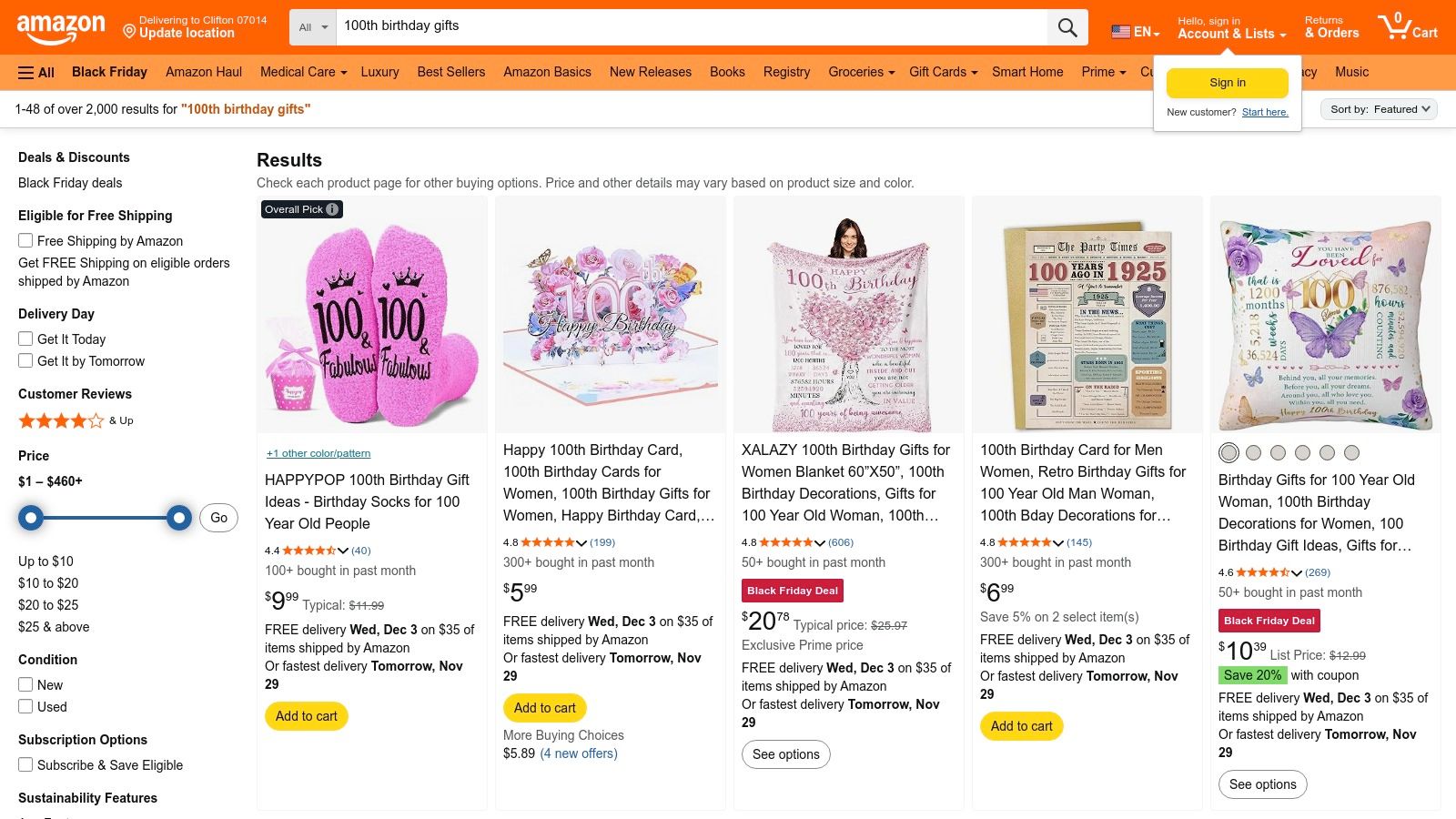 A screenshot of Amazon search results for "100 year birthday gifts" showing various products like mugs, sashes, and decorations.
