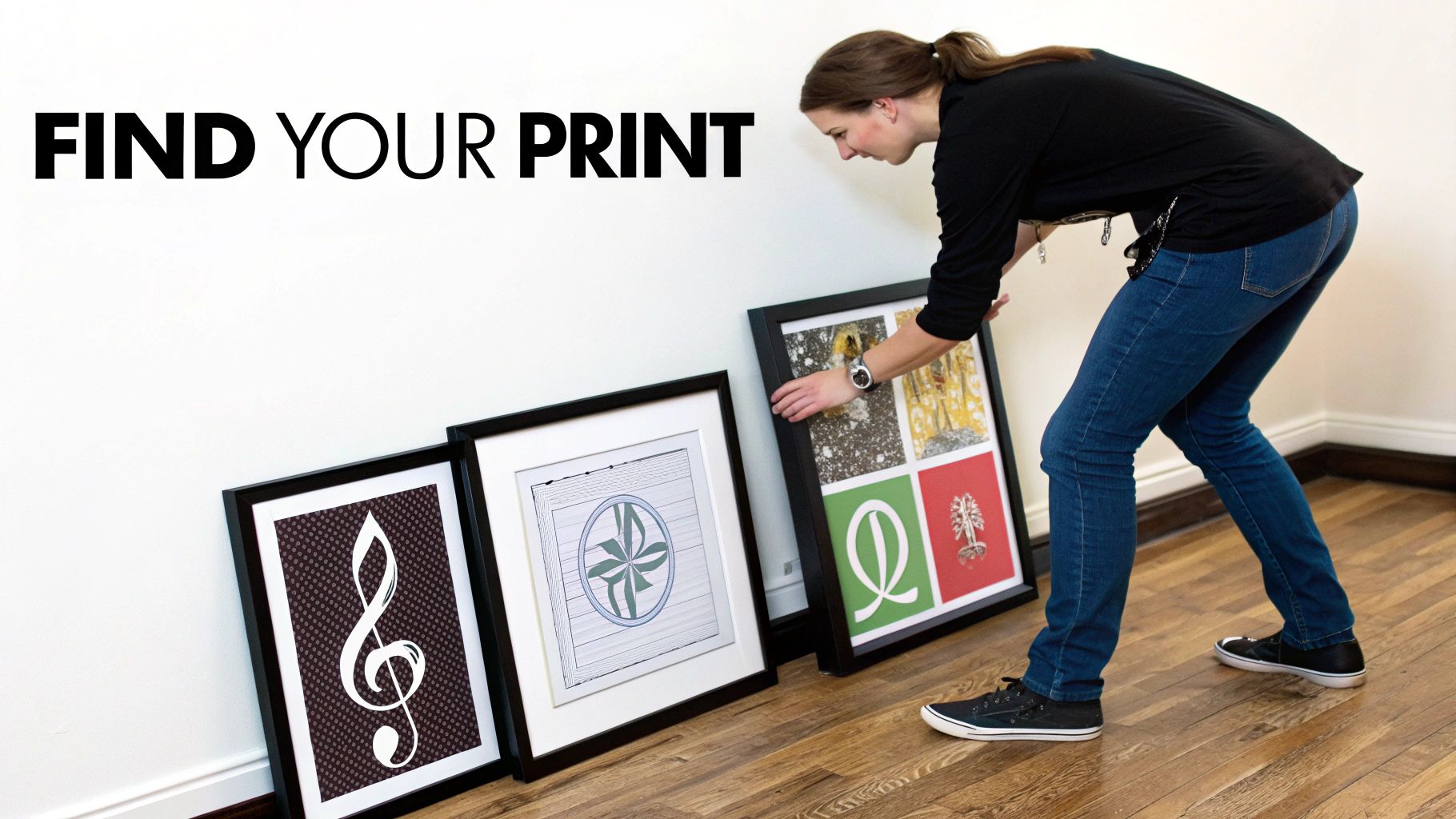 A woman arranges three framed art prints on a wooden floor under "FIND YOUR PRINT" text.