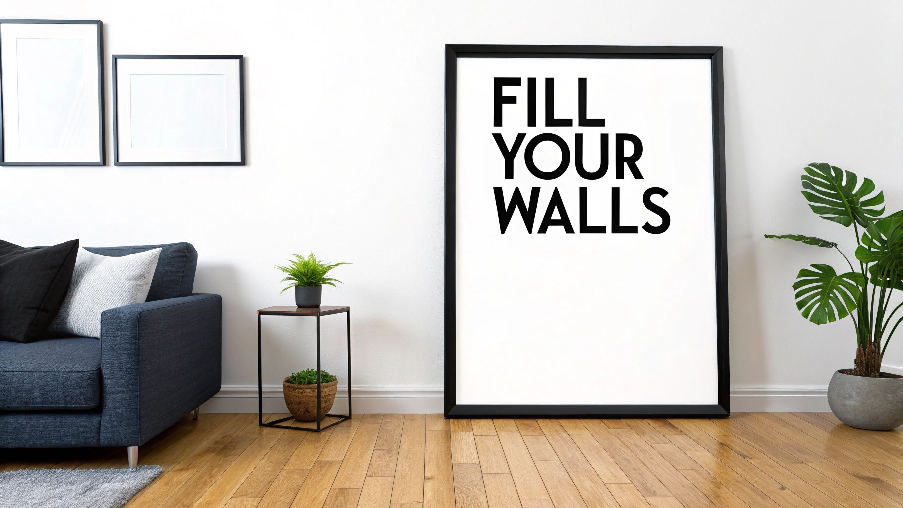 Modern living room with a navy sofa, plants, and framed wall art including a large poster that says 'FILL YOUR WALLS'.