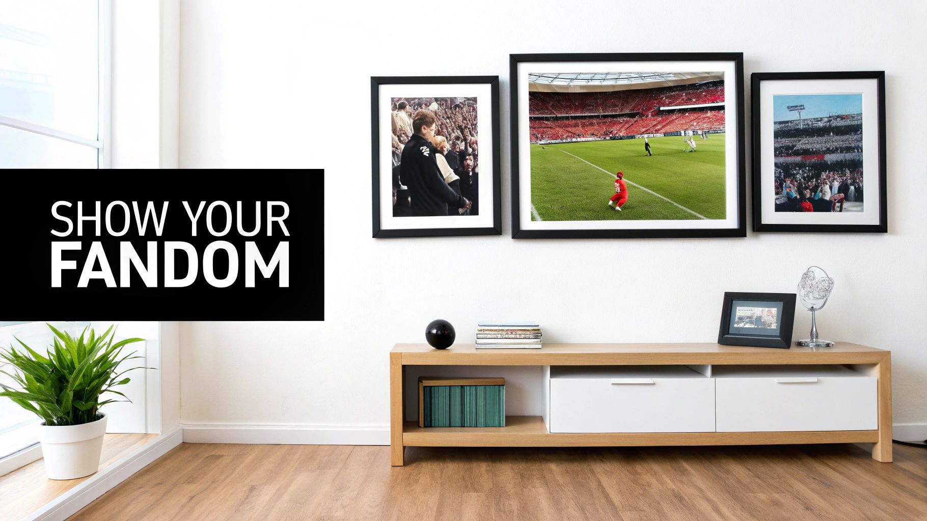Modern living room with a wooden media console, potted plant, and three framed sports fandom art.