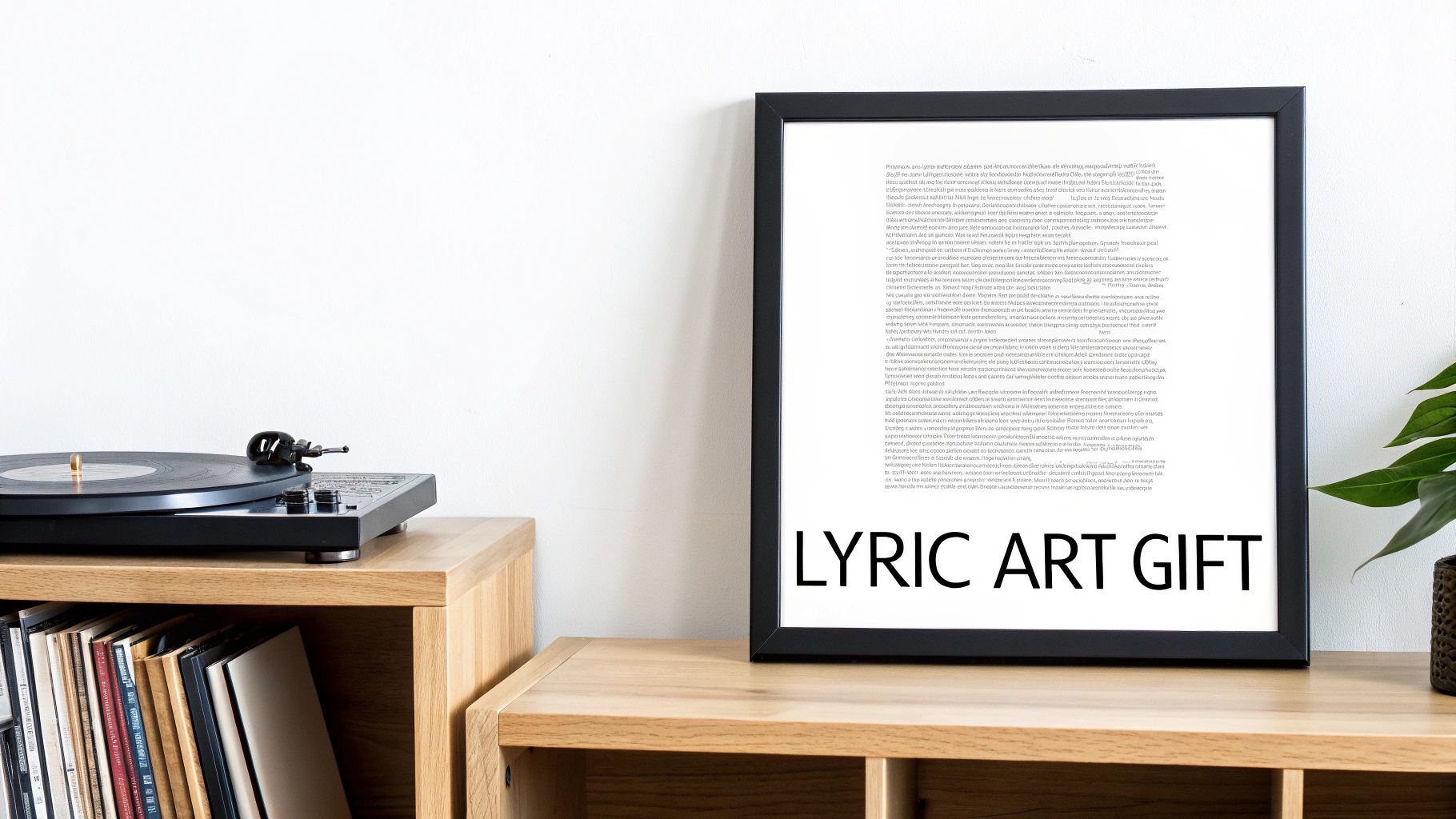 A record player and vinyl records on a wooden shelf, next to a framed 'LYRIC ART GIFT' print.