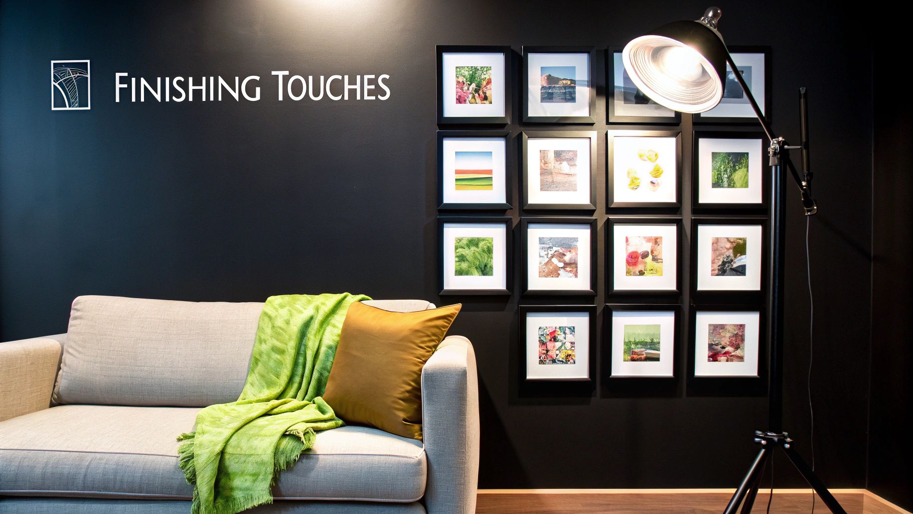 Modern living room with a gray sofa, green throw, and a gallery wall of art prints.