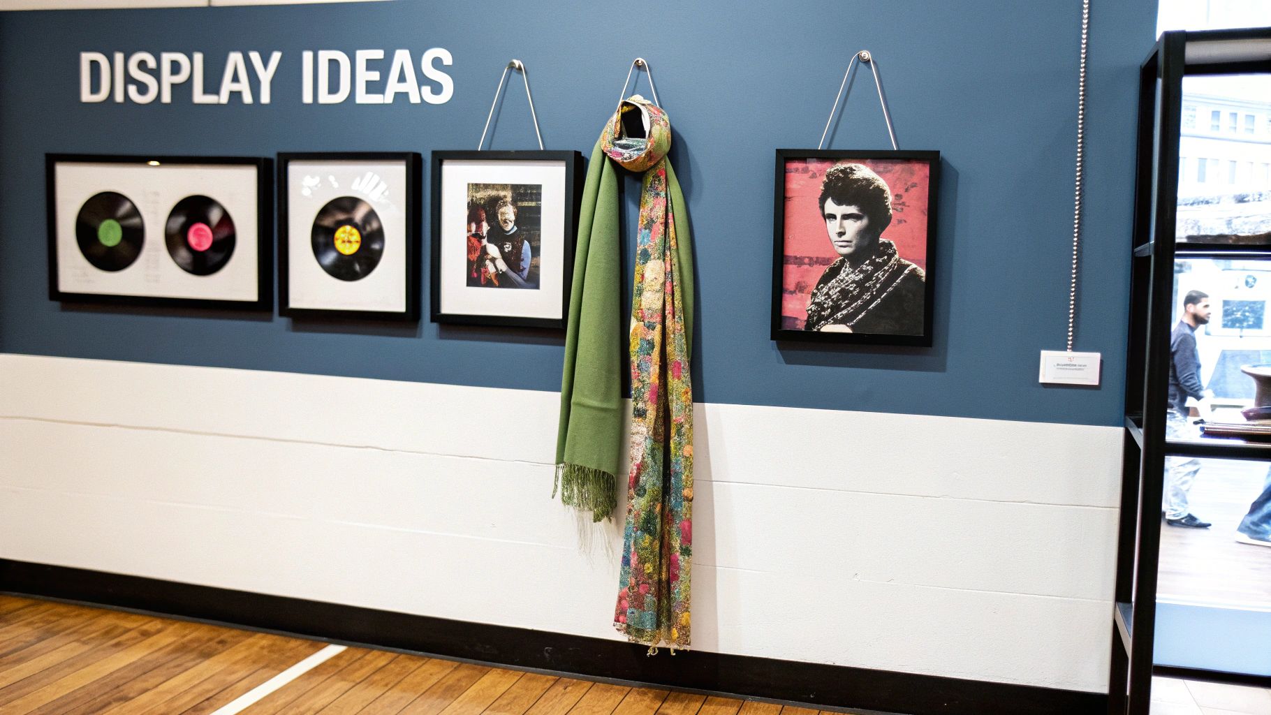 A collection of retro music posters displayed on a wall.