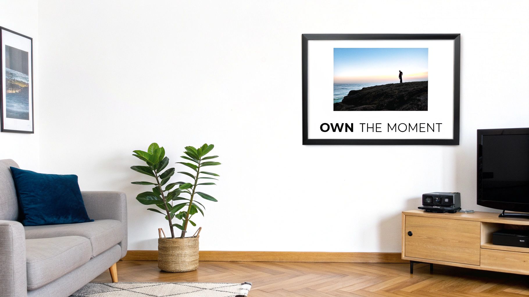 Modern living room with framed motivational print above wooden TV console and houseplant