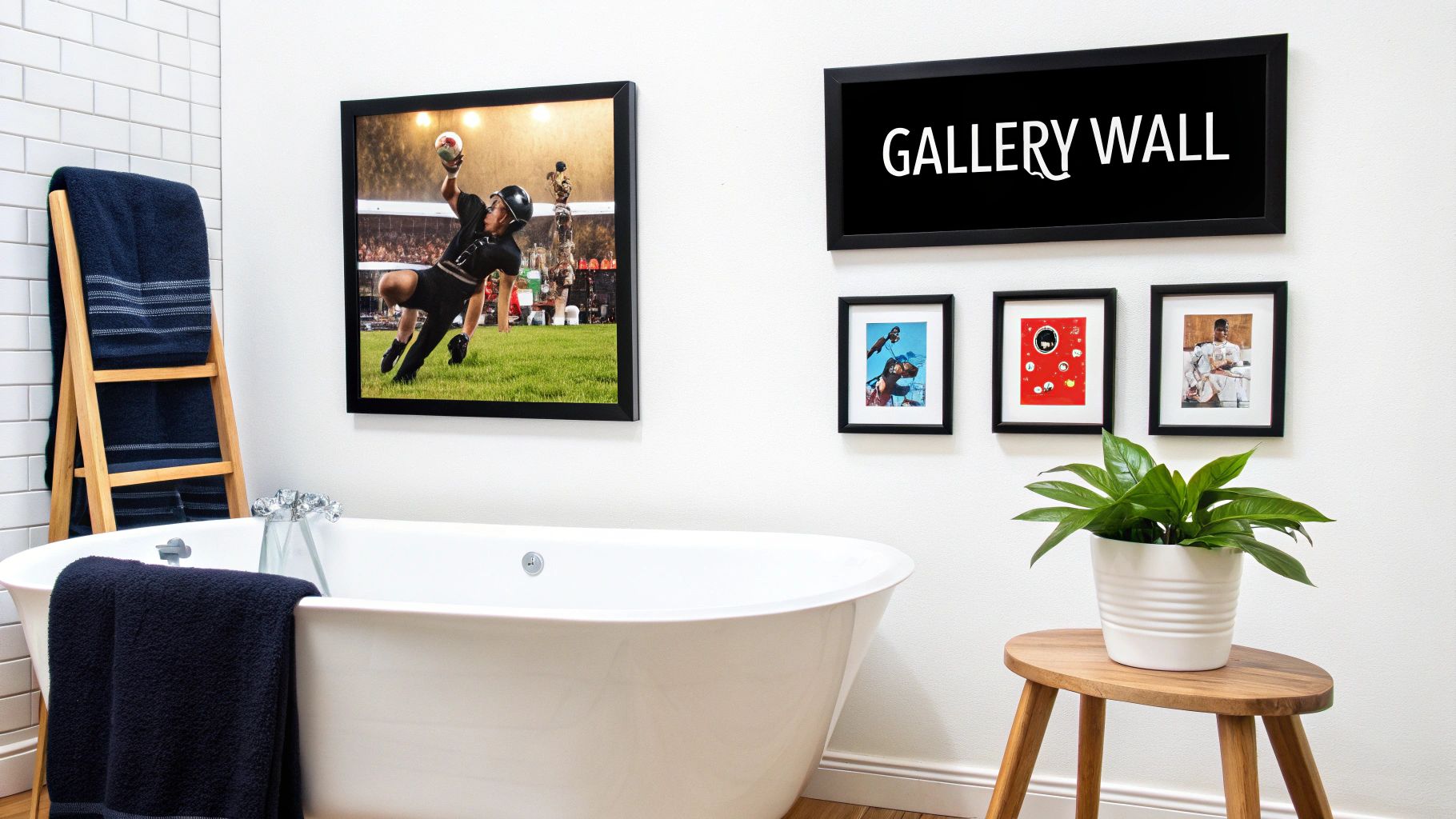 A modern bathroom features a white freestanding tub, a large framed football print, and a gallery wall.