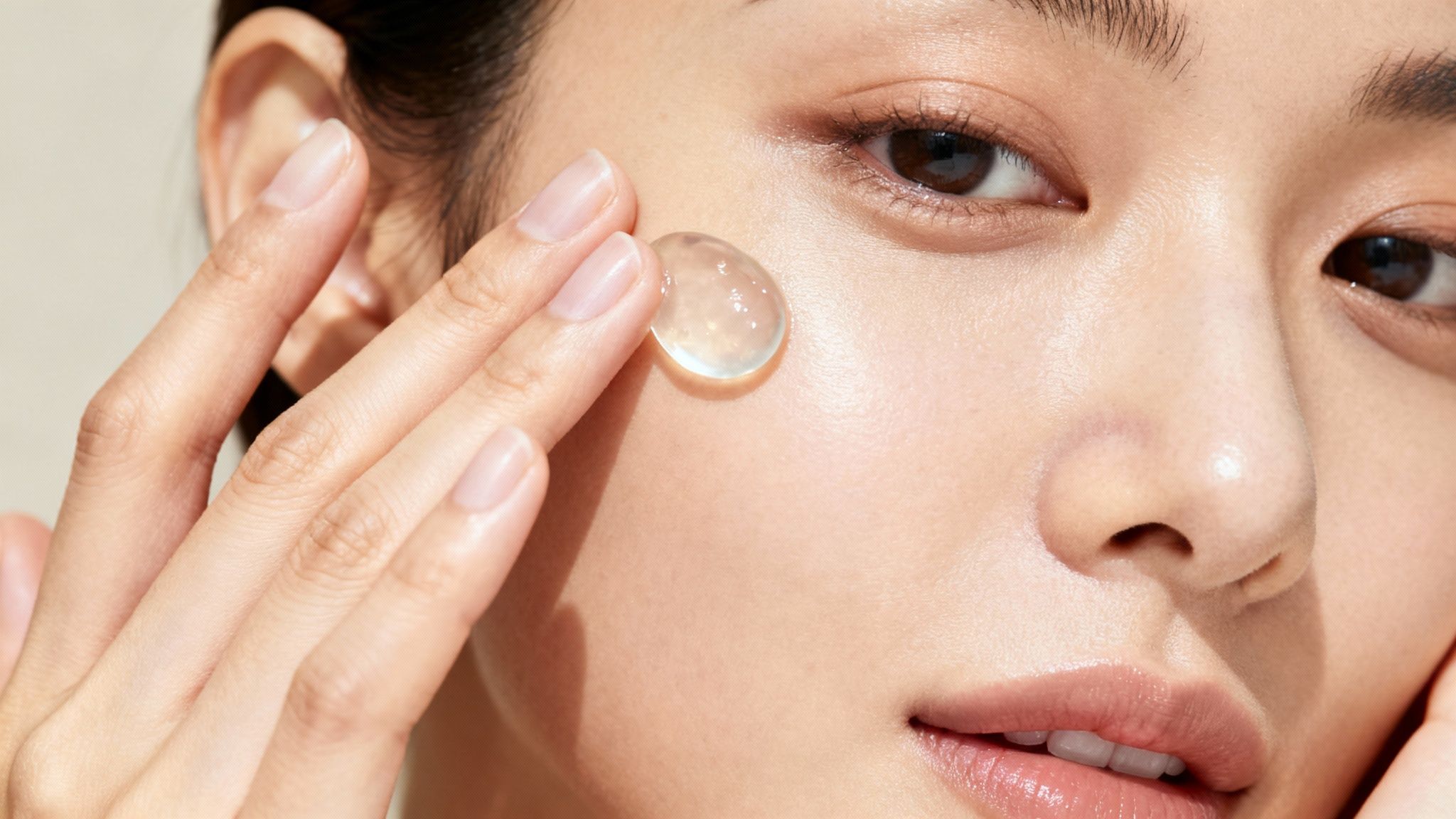 Different skincare ingredients like aloe vera, oils, and glycerin being mixed.