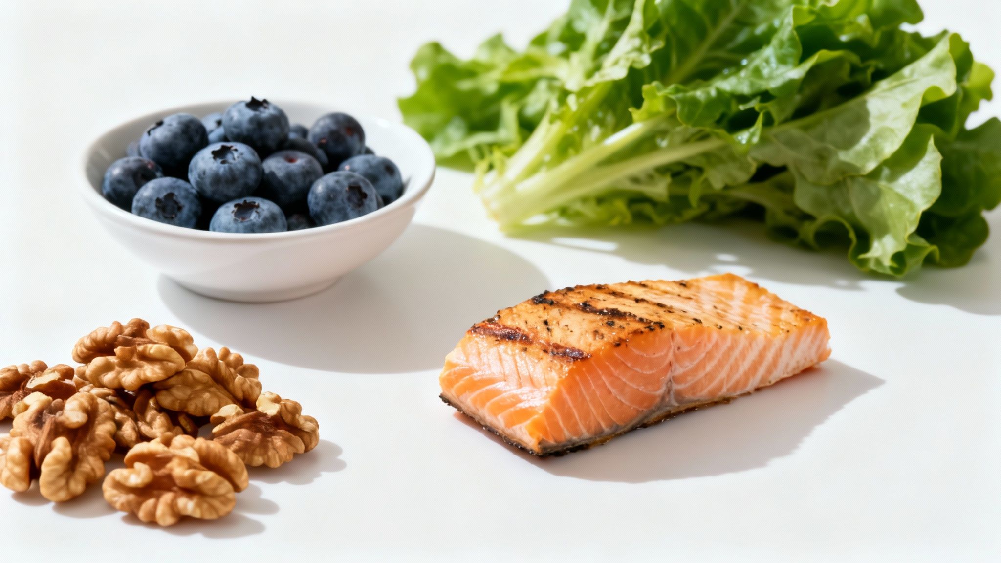 A colorful spread of fresh fruits, vegetables, nuts, and fish arranged on a wooden table, representing a diet supportive of joint wellness.