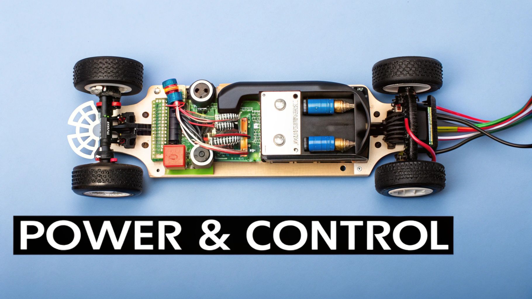 Overhead view of a disassembled remote control car chassis, exposing intricate electronics, battery, and wheels with text 'POWER & CONTROL'.