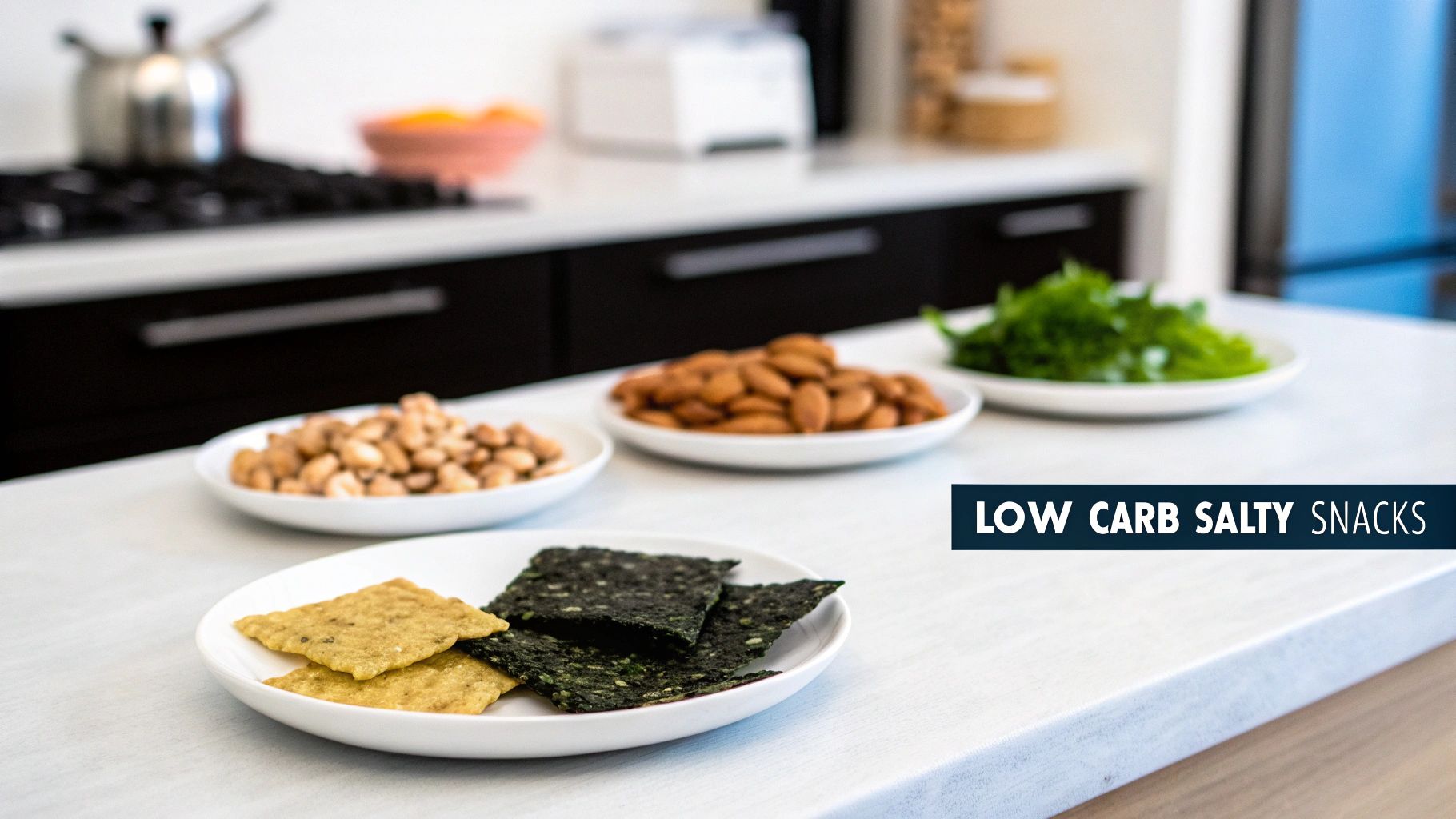 A variety of low carb salty snacks including seaweed, crackers, peanuts, almonds, and greens on a kitchen counter.