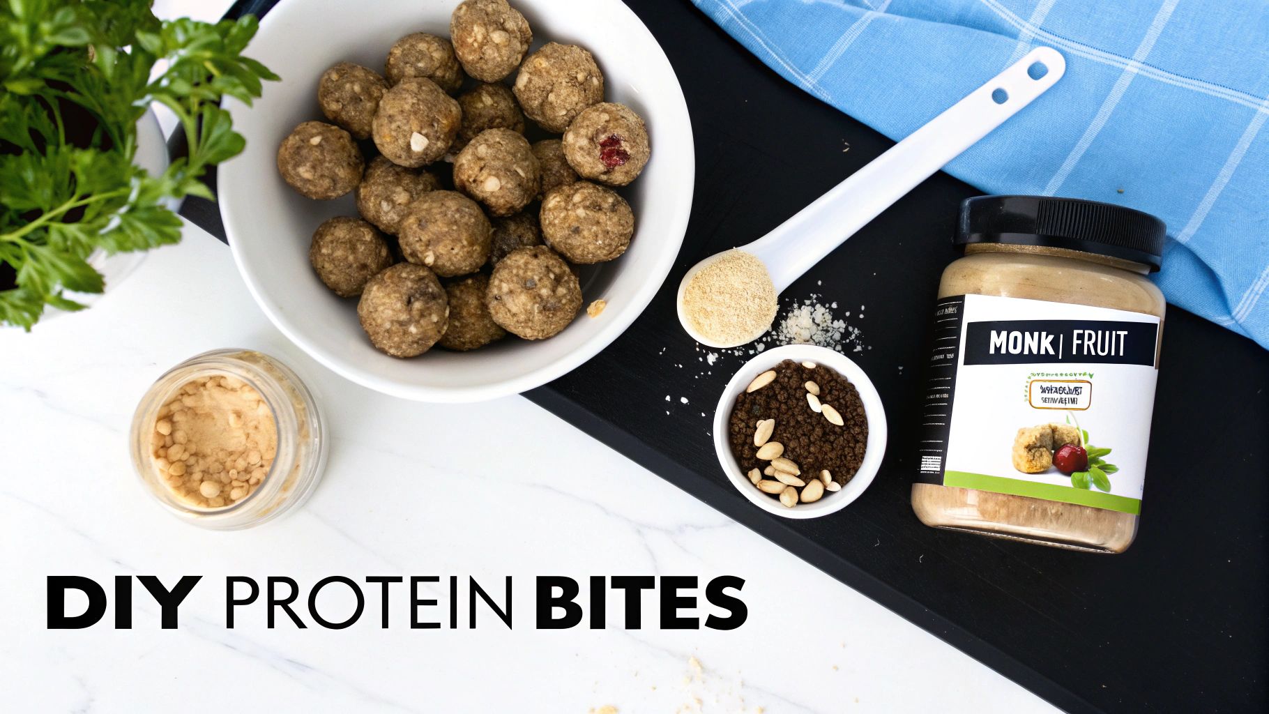 Overhead shot of homemade protein bites in a bowl with ingredients like monk fruit and nuts on a board.