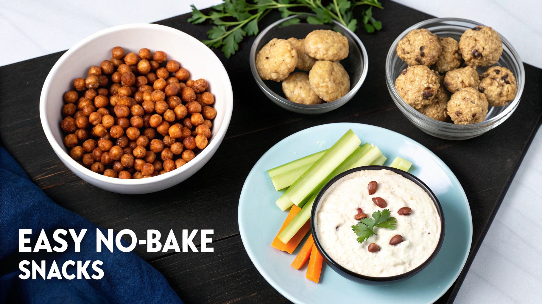 A close-up view of various easy no-bake snacks: roasted chickpeas, energy balls, and vegetable sticks with dip.