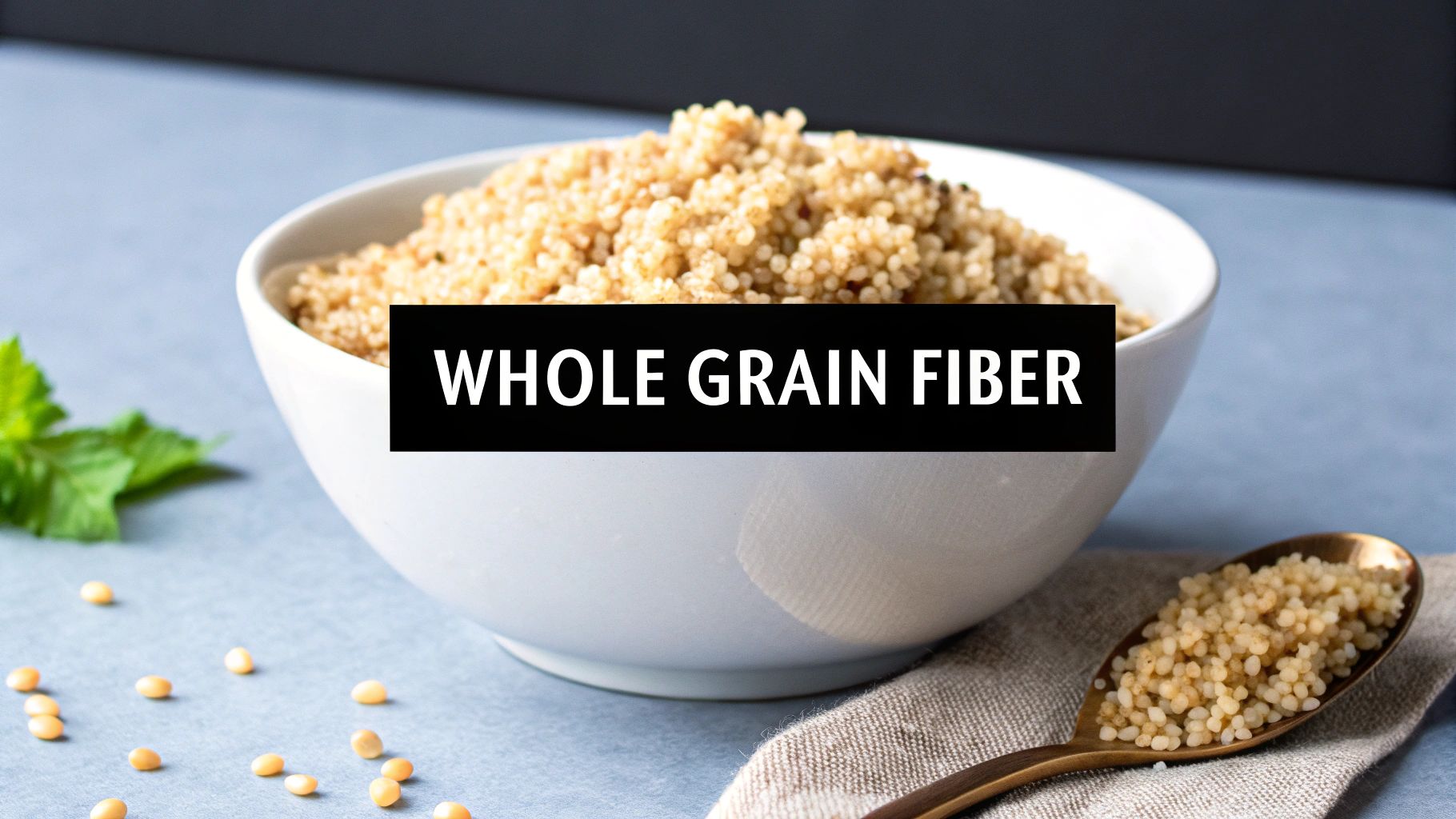A white bowl and a spoon filled with whole grains, with the text 'WHOLE GRAIN FIBER'.