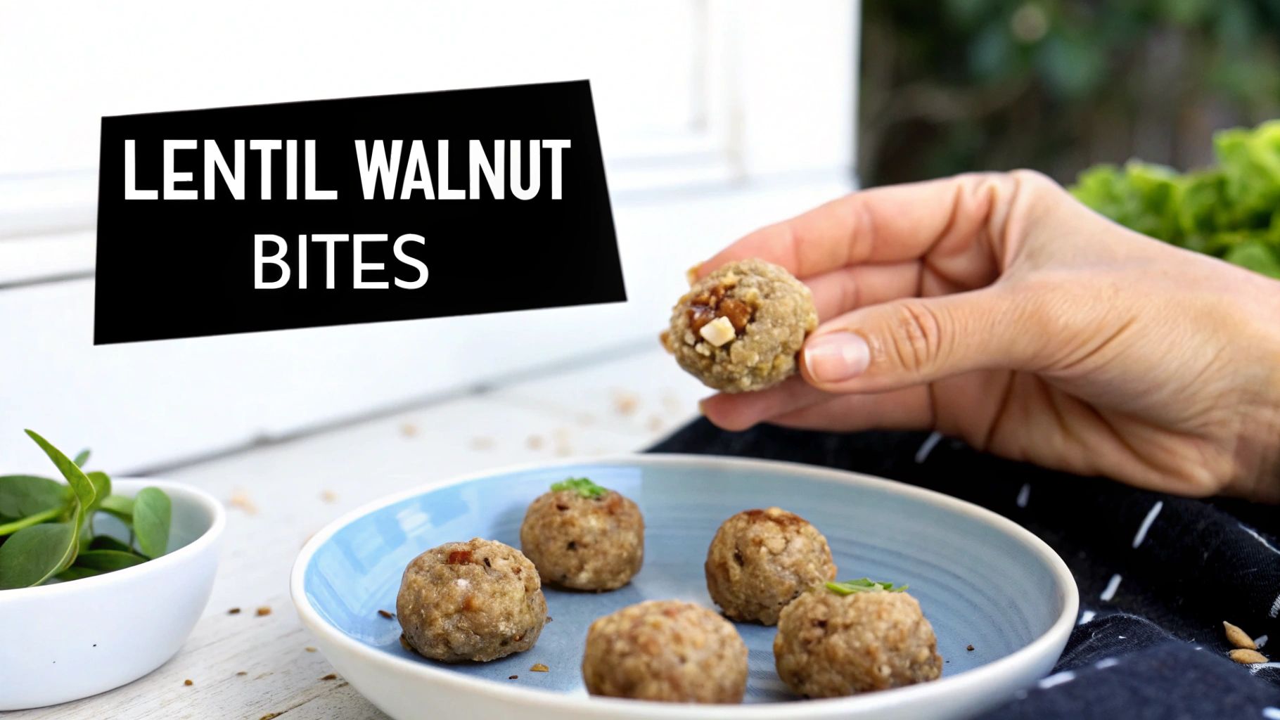 A hand holds a lentil walnut bite with chopped nuts, while more bites rest on a blue plate, labeled 'LENTIL WALNUT BITES'.