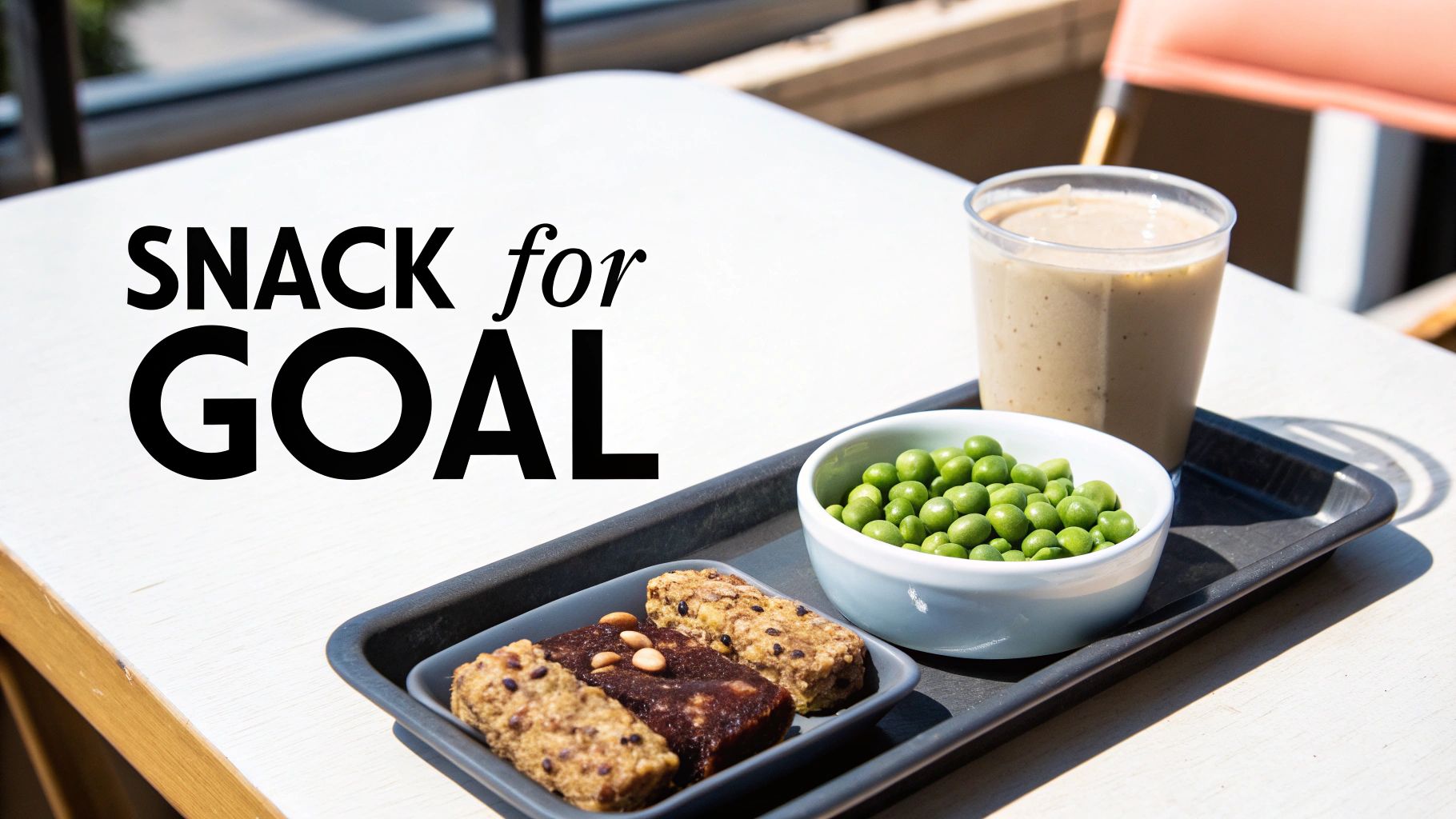Healthy protein snack tray with granola bars, edamame beans, and smoothie on table
