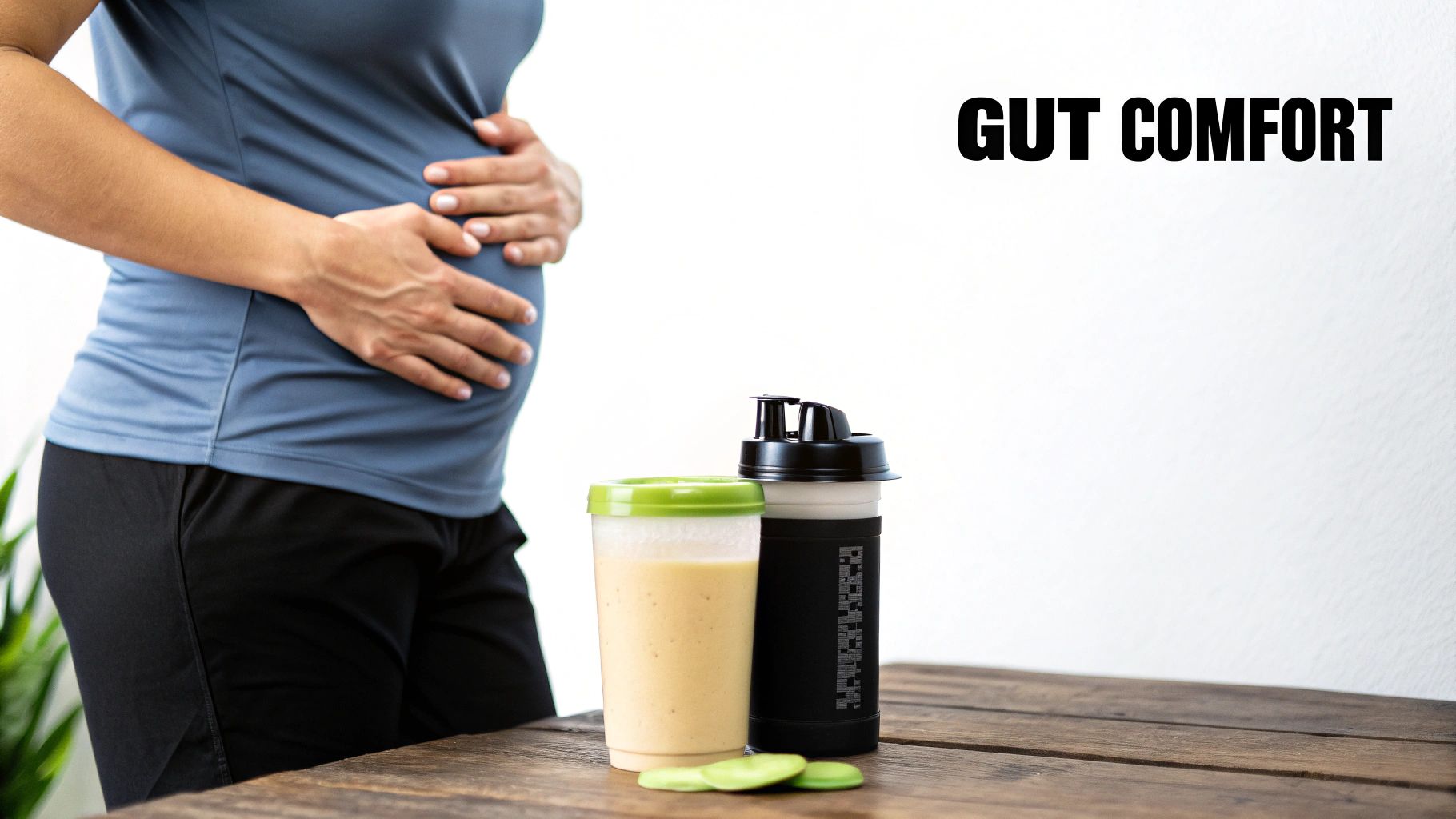 A person holds their stomach, next to two protein shakers on a table, with 'GUT COMFORT' text.