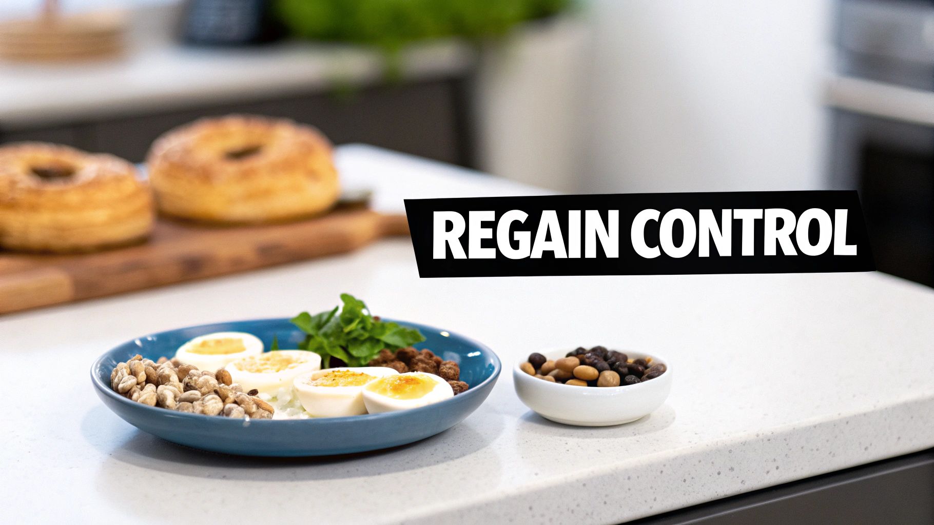 A kitchen counter with a blue bowl of boiled eggs and nuts, a small bowl of dried fruits, and pastries in the background.