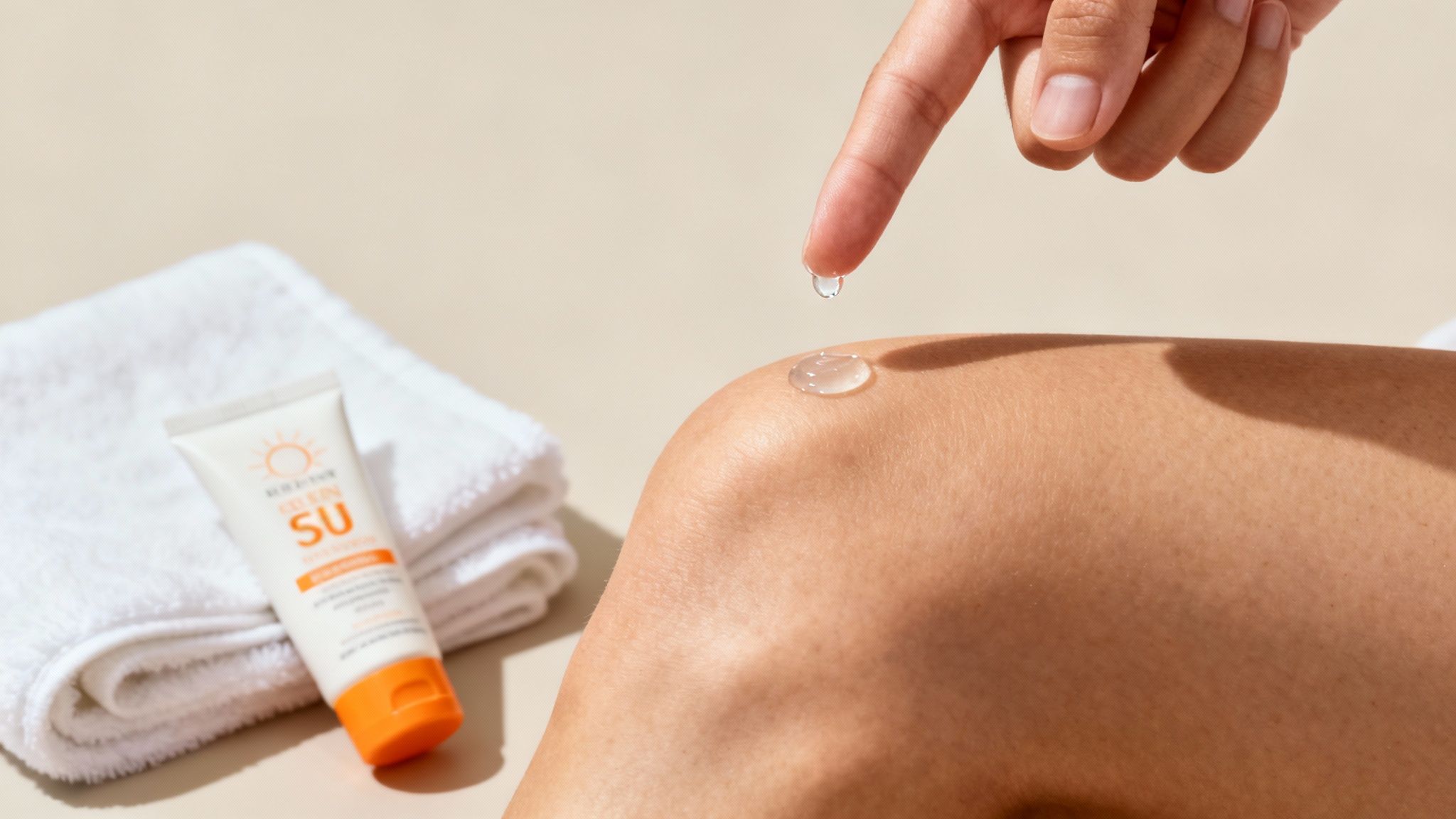 A woman applying soothing cream to her smooth legs, representing aftercare for hair removal.