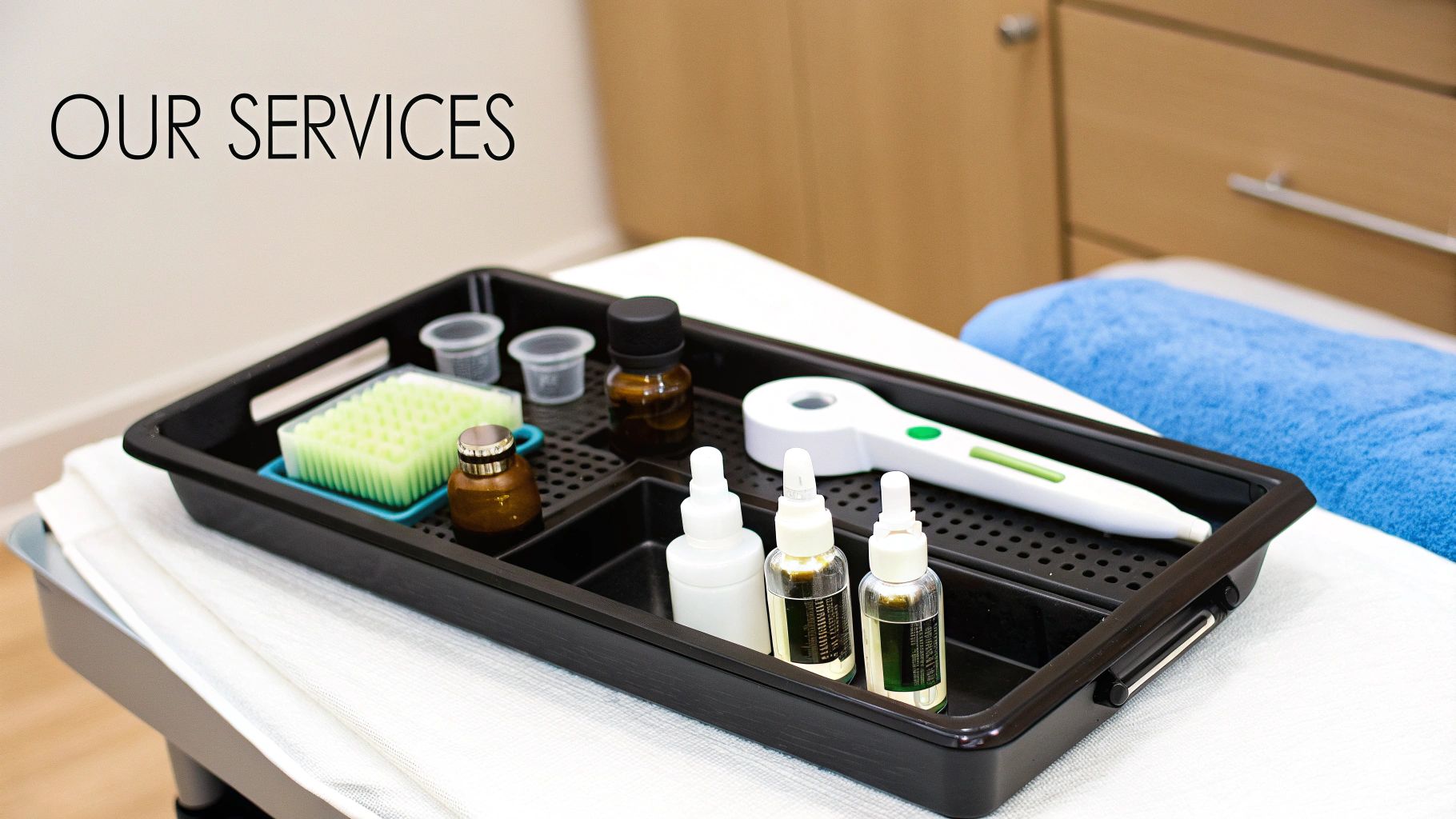 Tray containing aesthetic treatment supplies like bottles, brushes, and a pen-like device, highlighting clinic services.