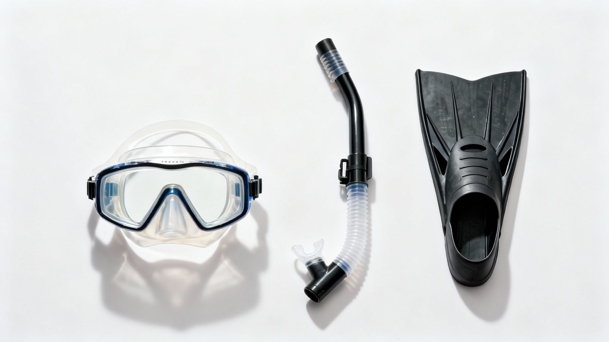 Snorkeling set with a clear diving mask, black snorkel, and black fin on a white background.