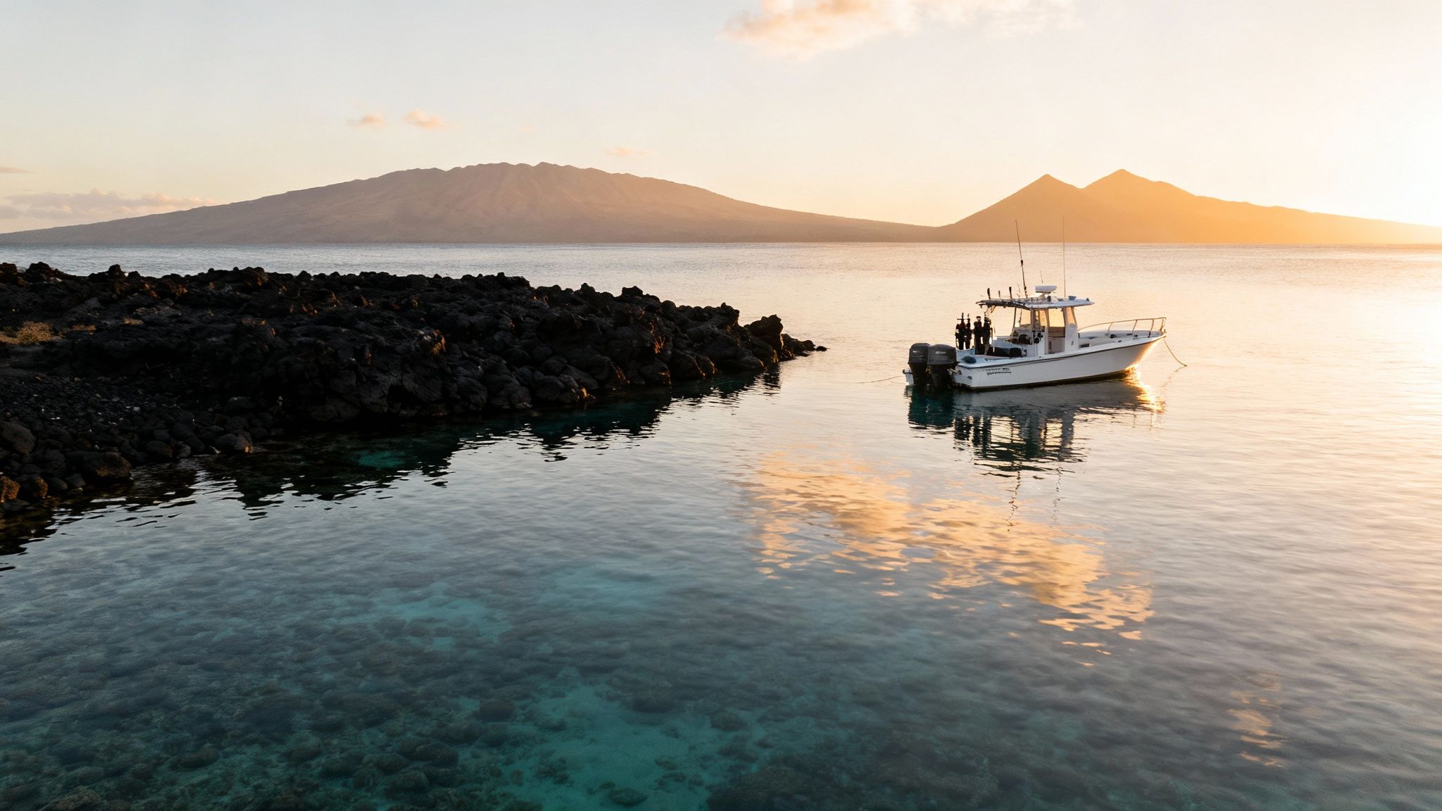 A scuba diver explores a vibrant coral reef in the clear blue waters off the Kona coast, Big Island, Hawaii.