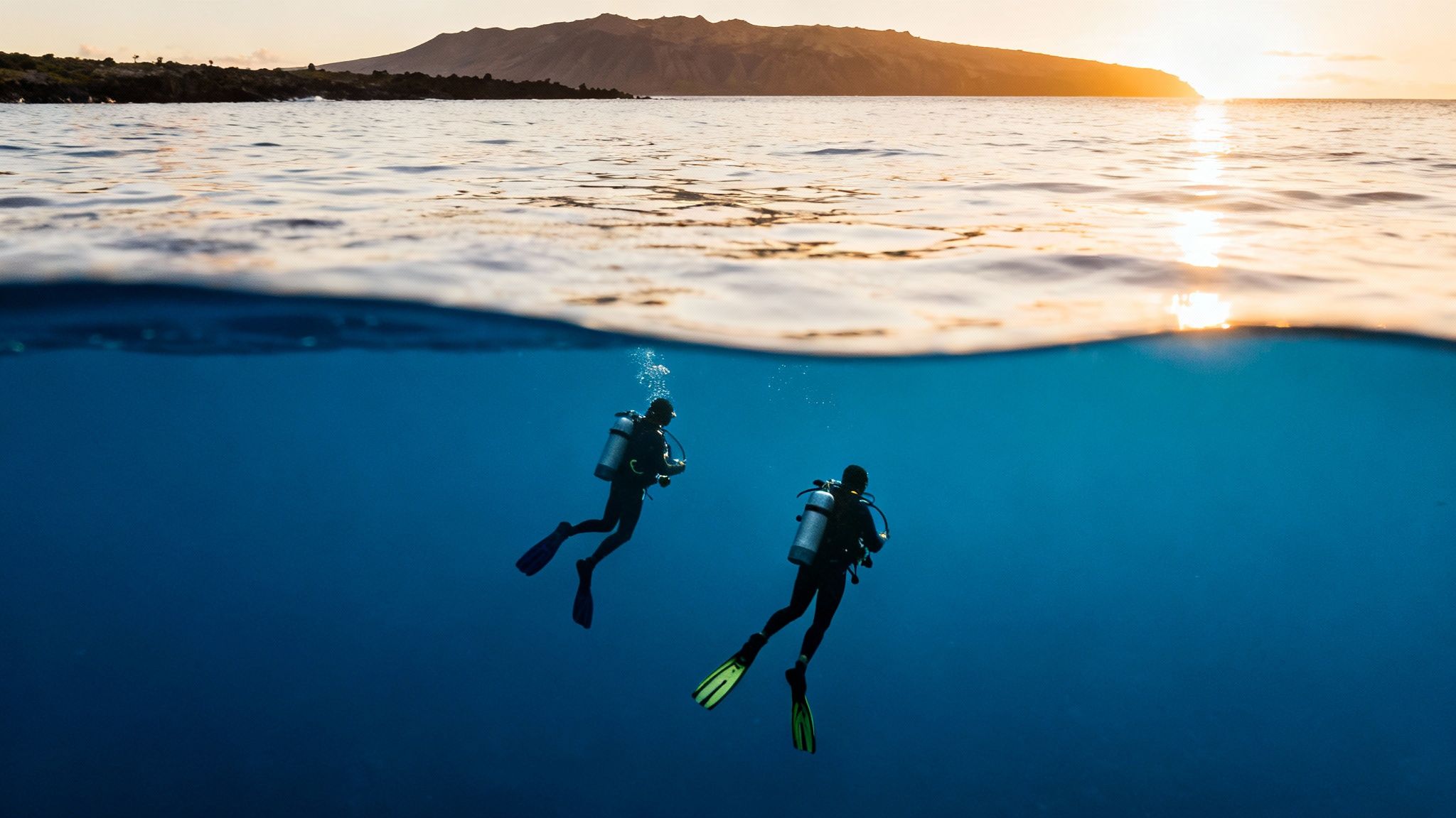 Divers exploring a volcanic reef
