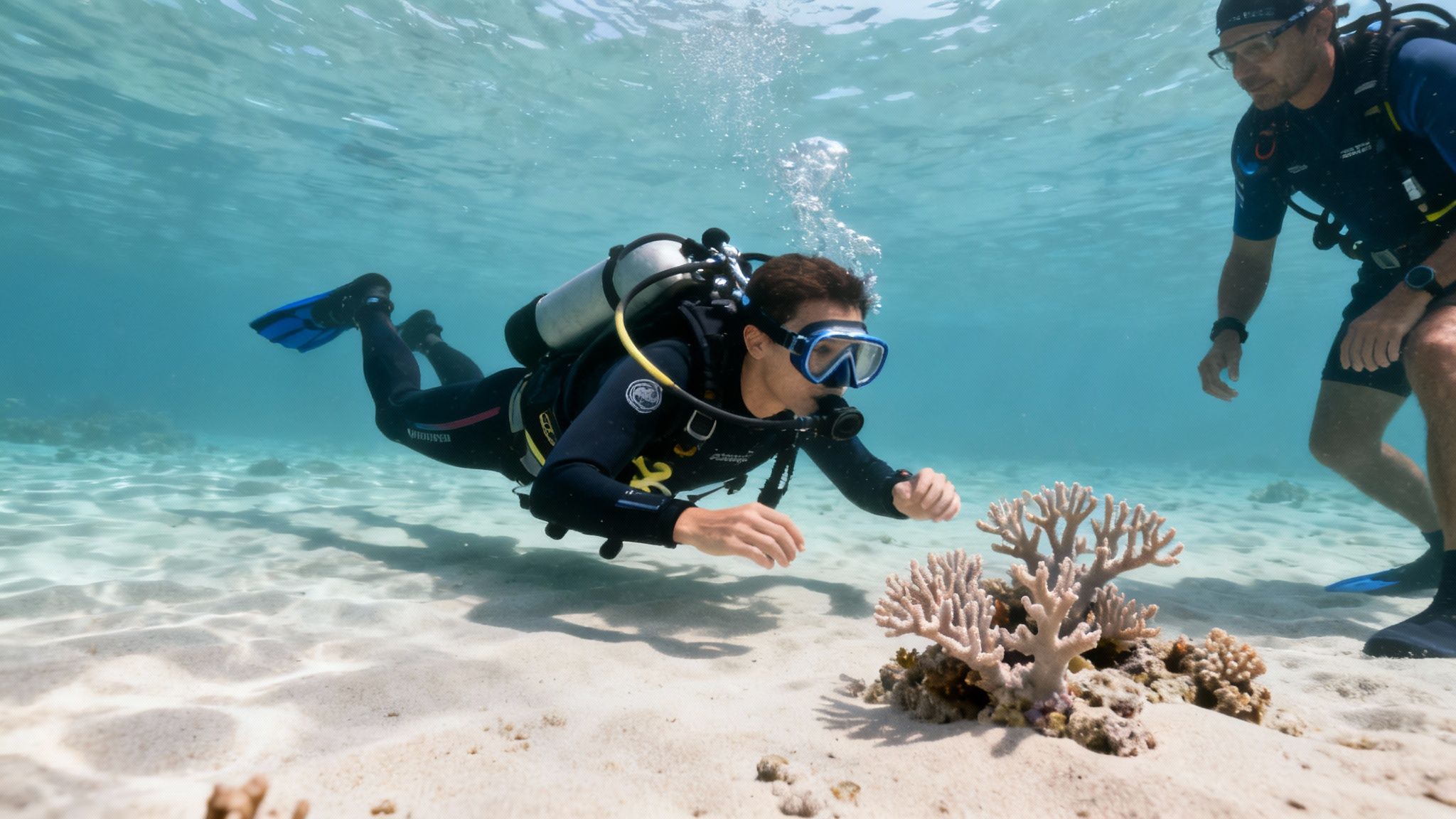 A group of scuba divers learning skills in the clear blue water of Kona.